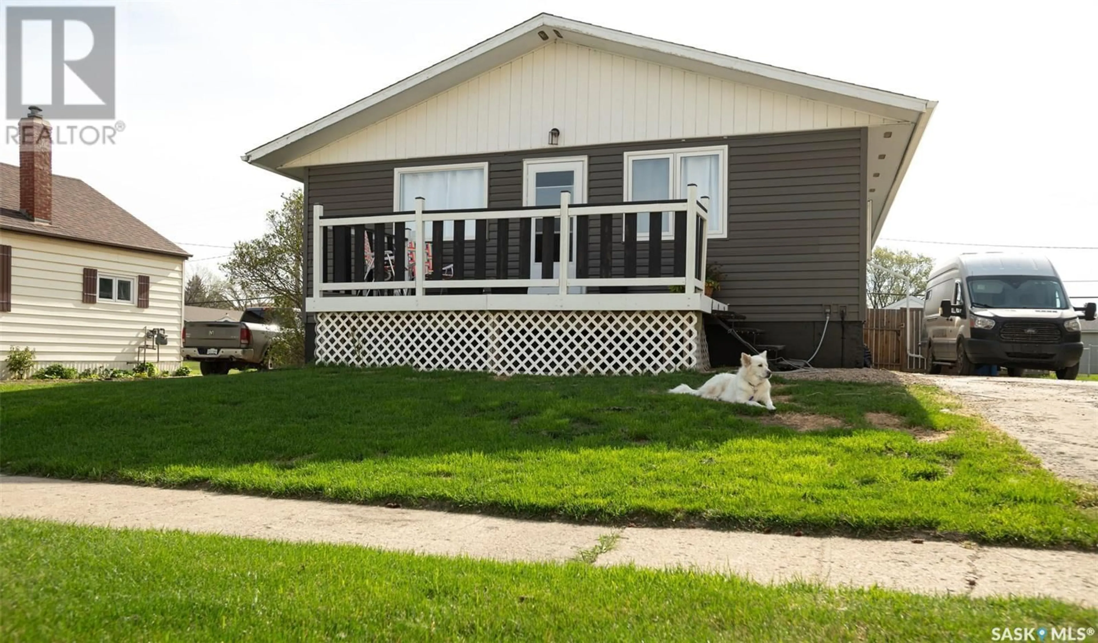 Home with vinyl exterior material, street for 1108 97TH STREET, Tisdale Saskatchewan S0E1T0