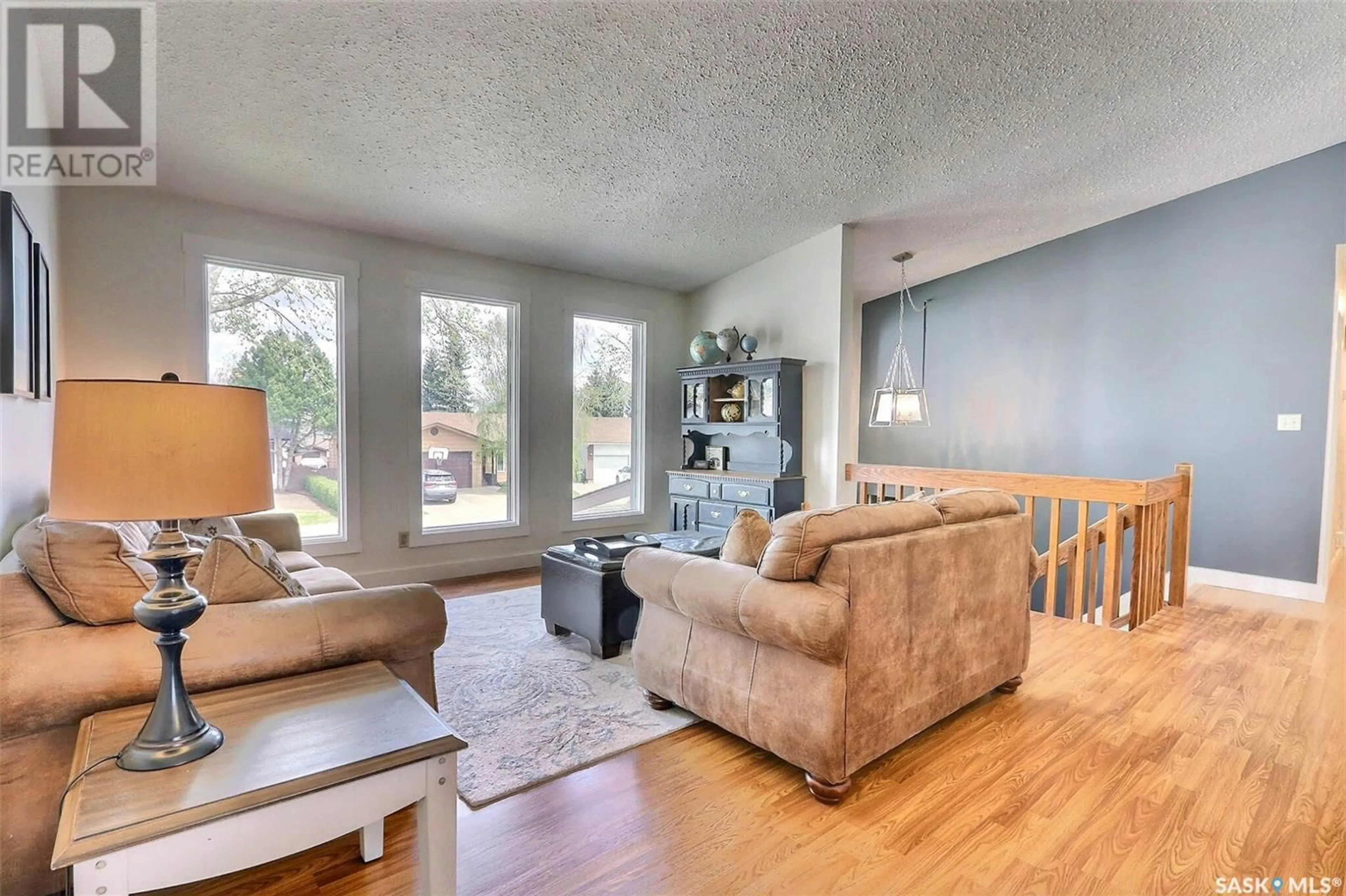 Living room with furniture, wood/laminate floor for 1575 BLISS CRESCENT, Prince Albert Saskatchewan S6V7N7