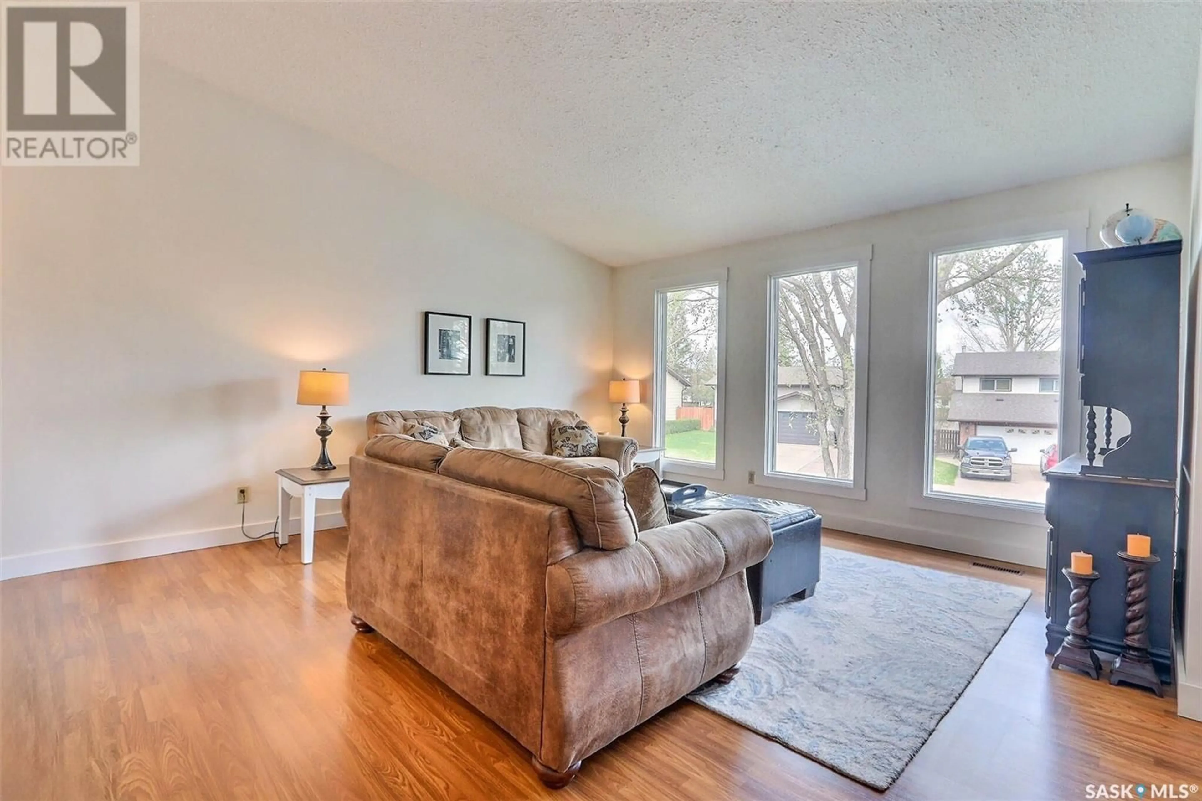 Living room with furniture, wood/laminate floor for 1575 BLISS CRESCENT, Prince Albert Saskatchewan S6V7N7