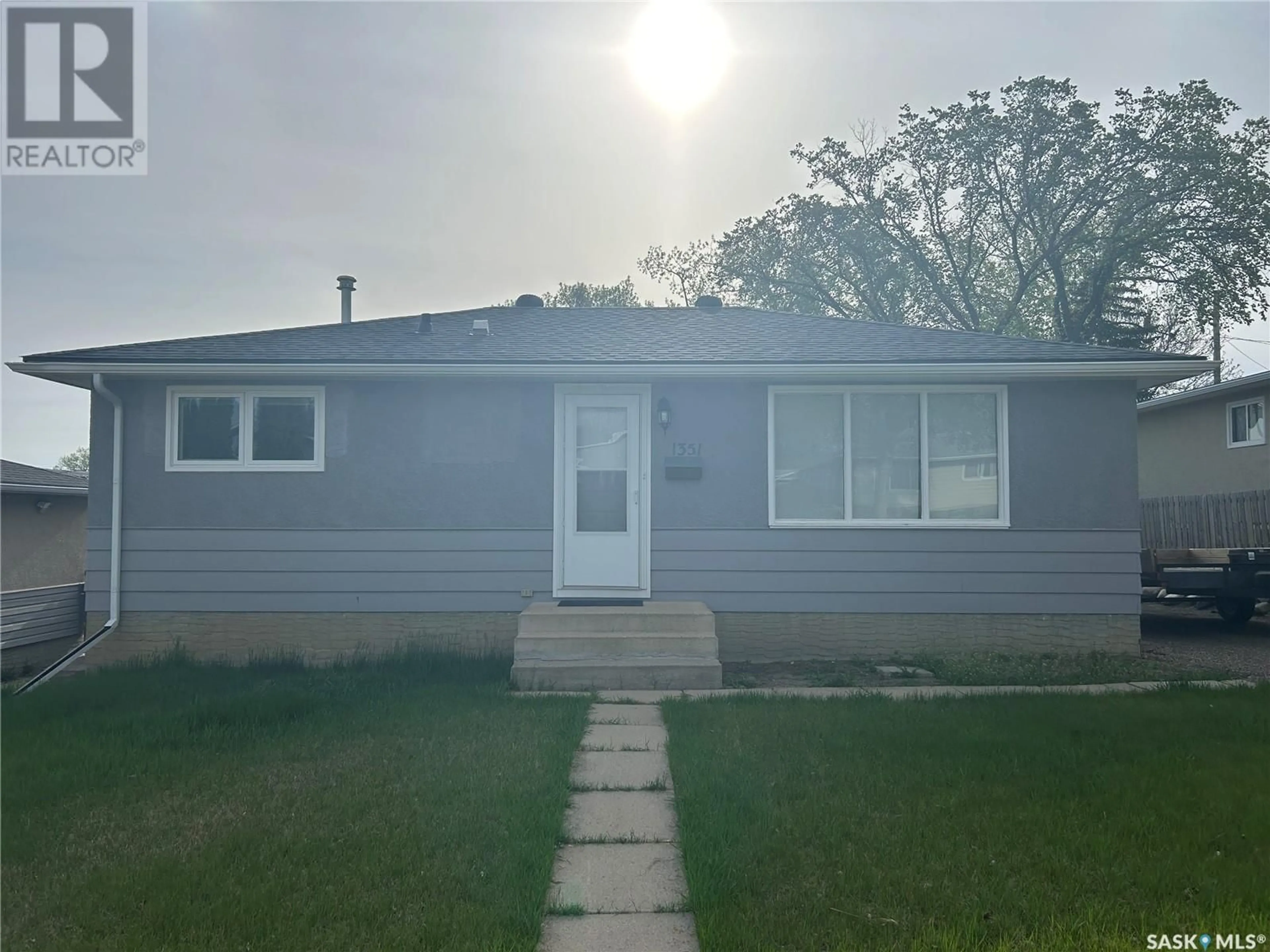 Home with vinyl exterior material, street for 1351 6TH AVENUE, Moose Jaw Saskatchewan S6H4A9