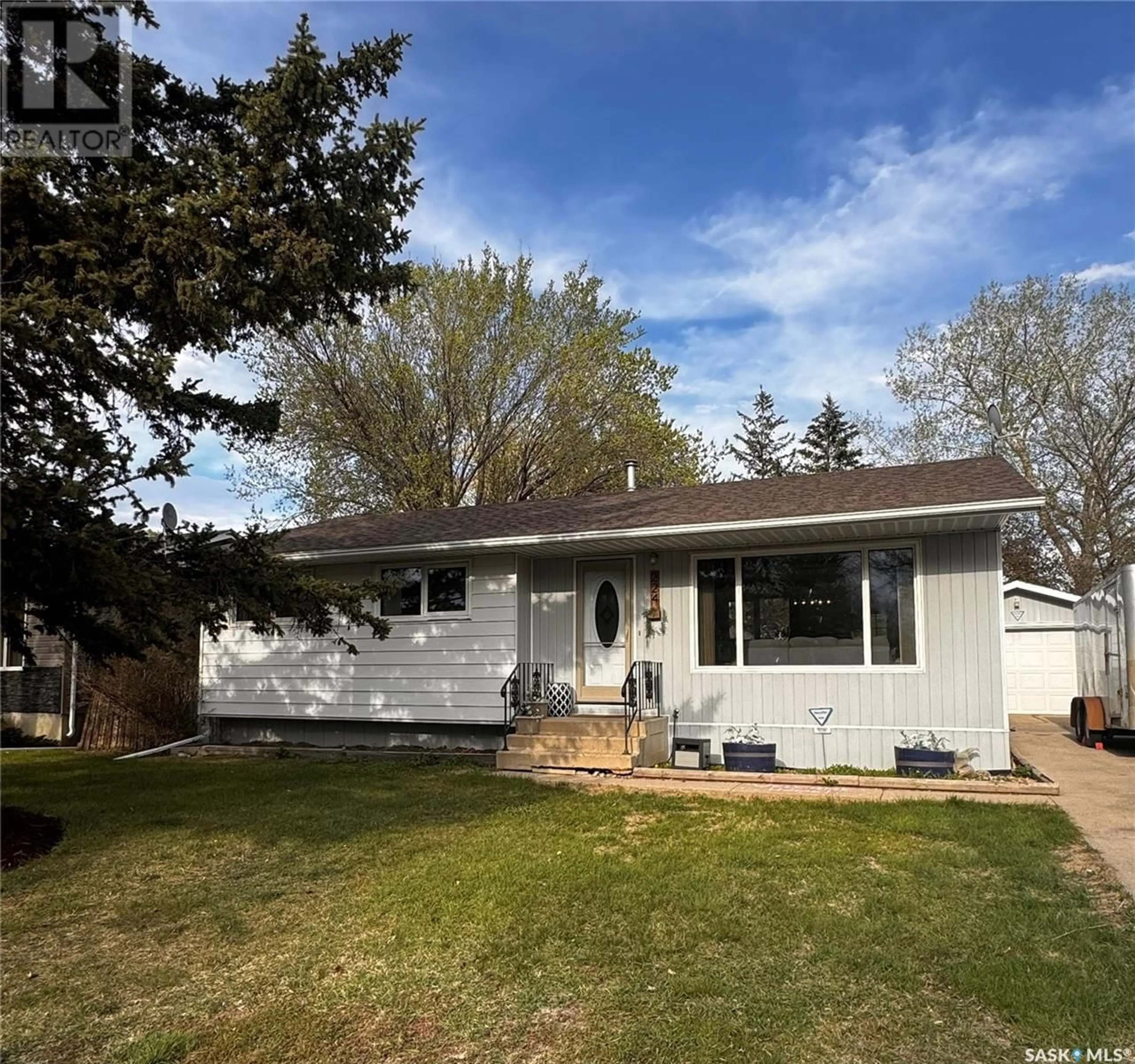 Home with vinyl exterior material, street for 224 17TH STREET, Weyburn Saskatchewan S4H2P2