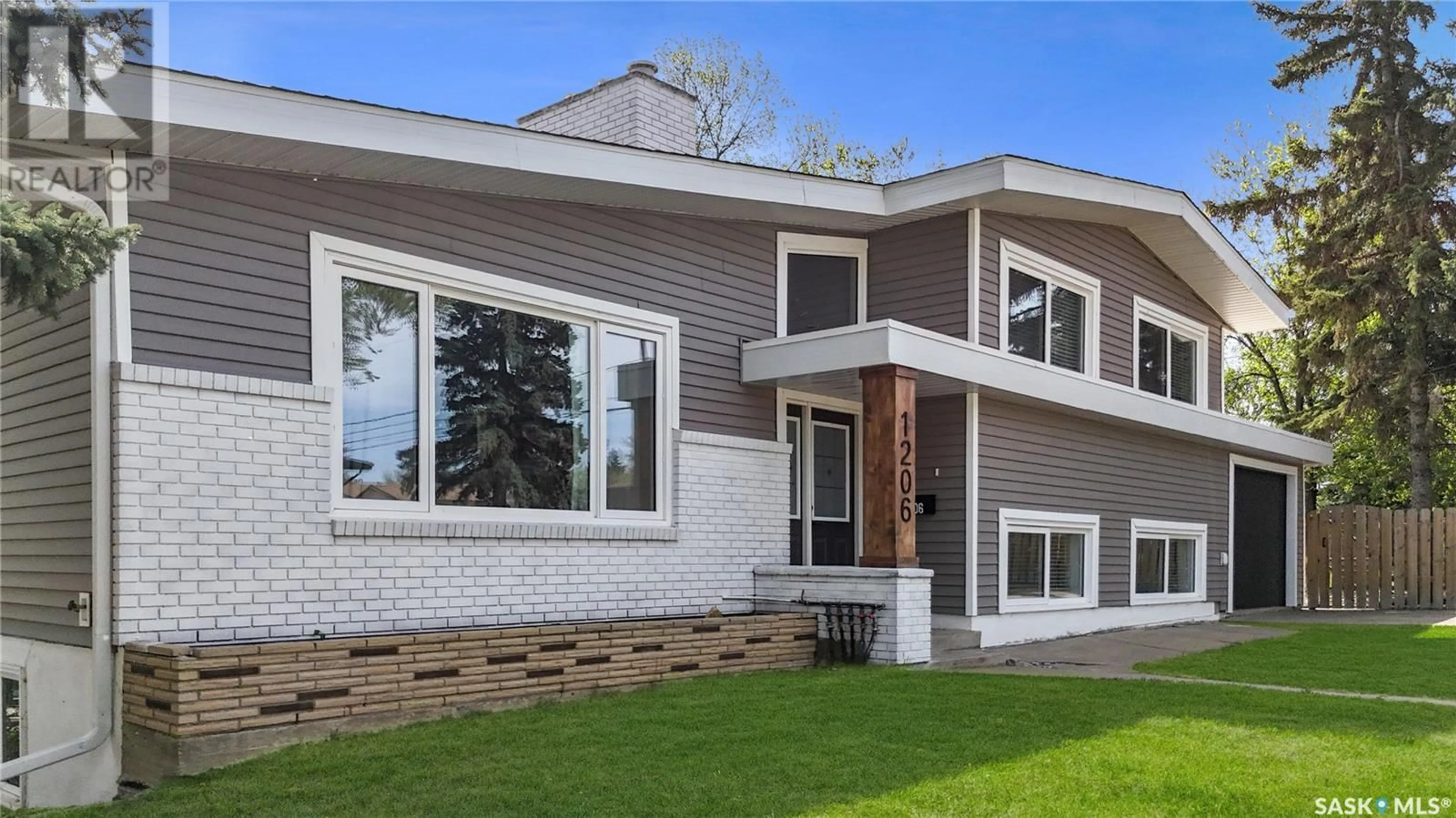 Home with vinyl exterior material, street for 1206 IRWIN DRIVE, Swift Current Saskatchewan S9H1Z7