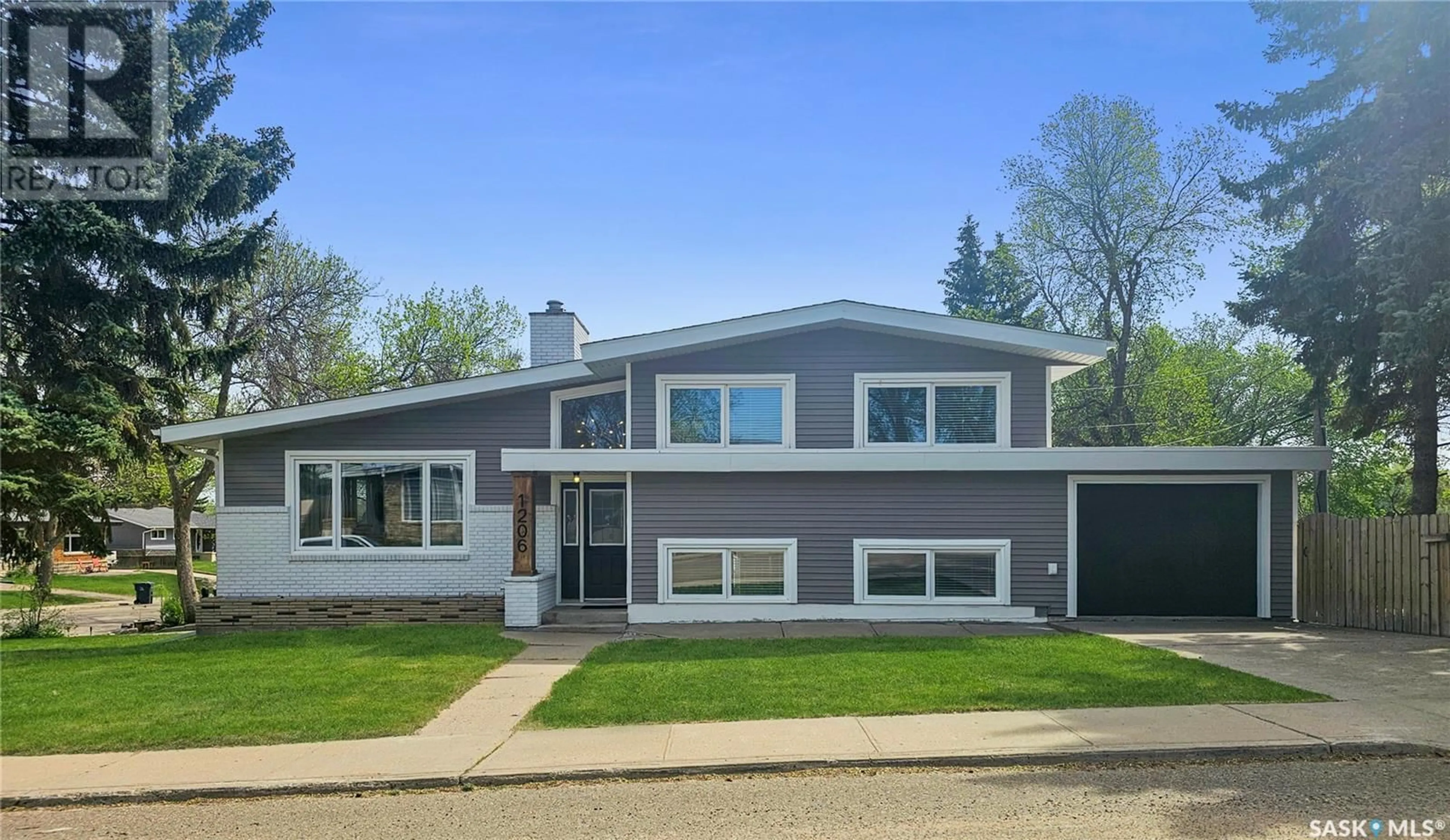 Home with vinyl exterior material, street for 1206 IRWIN DRIVE, Swift Current Saskatchewan S9H1Z7