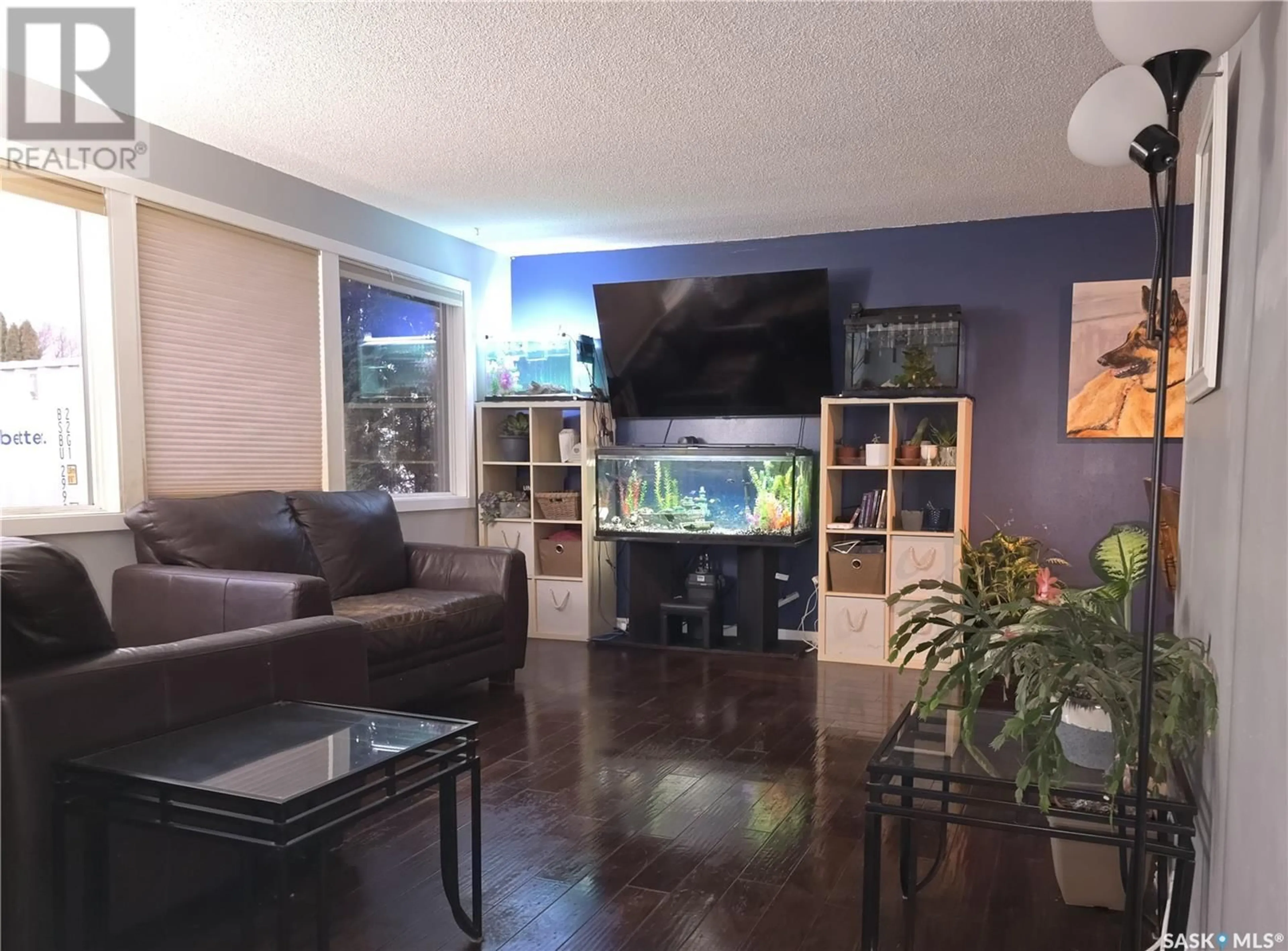Living room with furniture, wood/laminate floor for 30 LINDSAY DRIVE, Saskatoon Saskatchewan S7H3E1