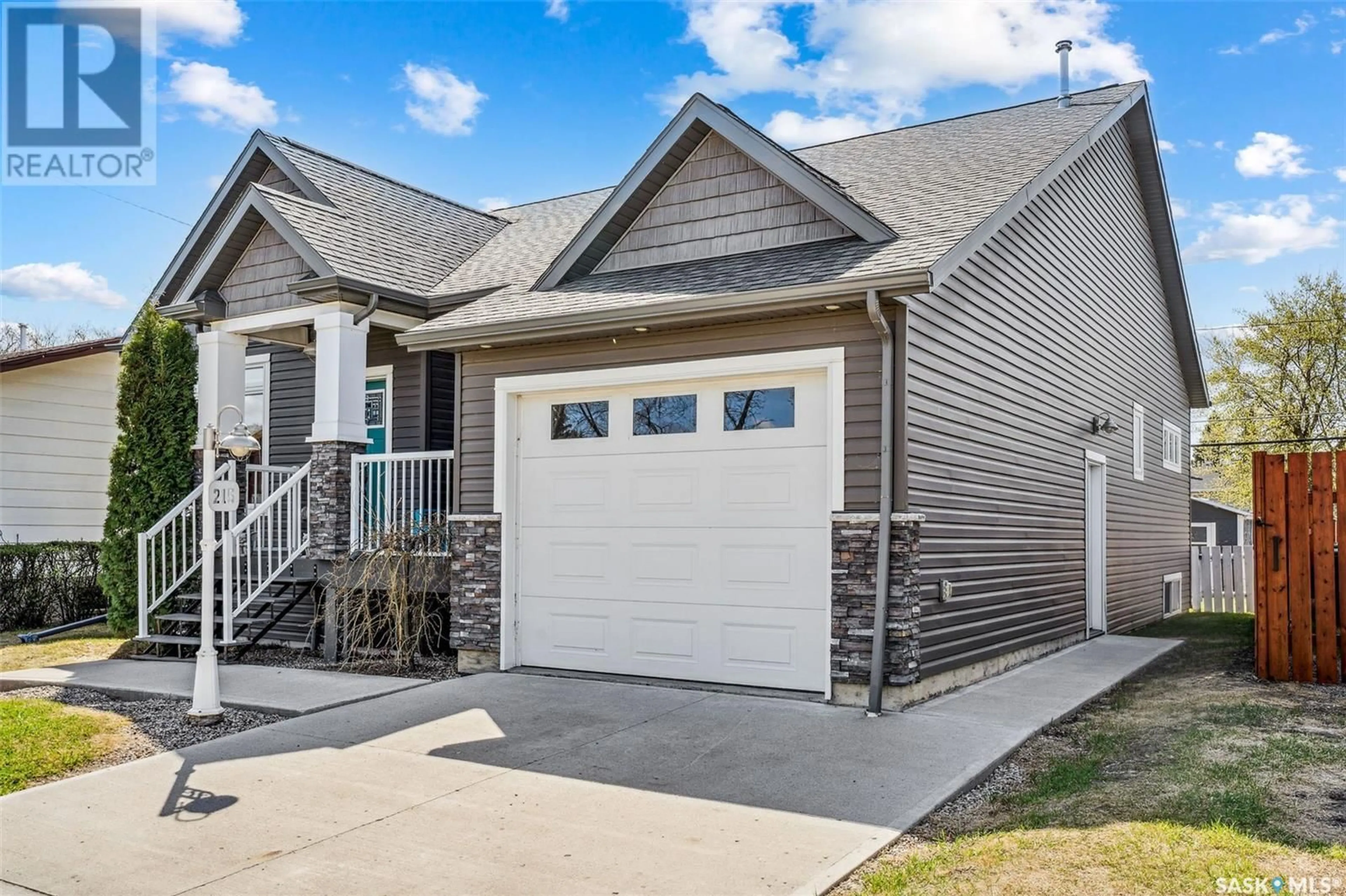 Home with vinyl exterior material, street for 215 2ND AVENUE, Shellbrook Saskatchewan S0J2E0