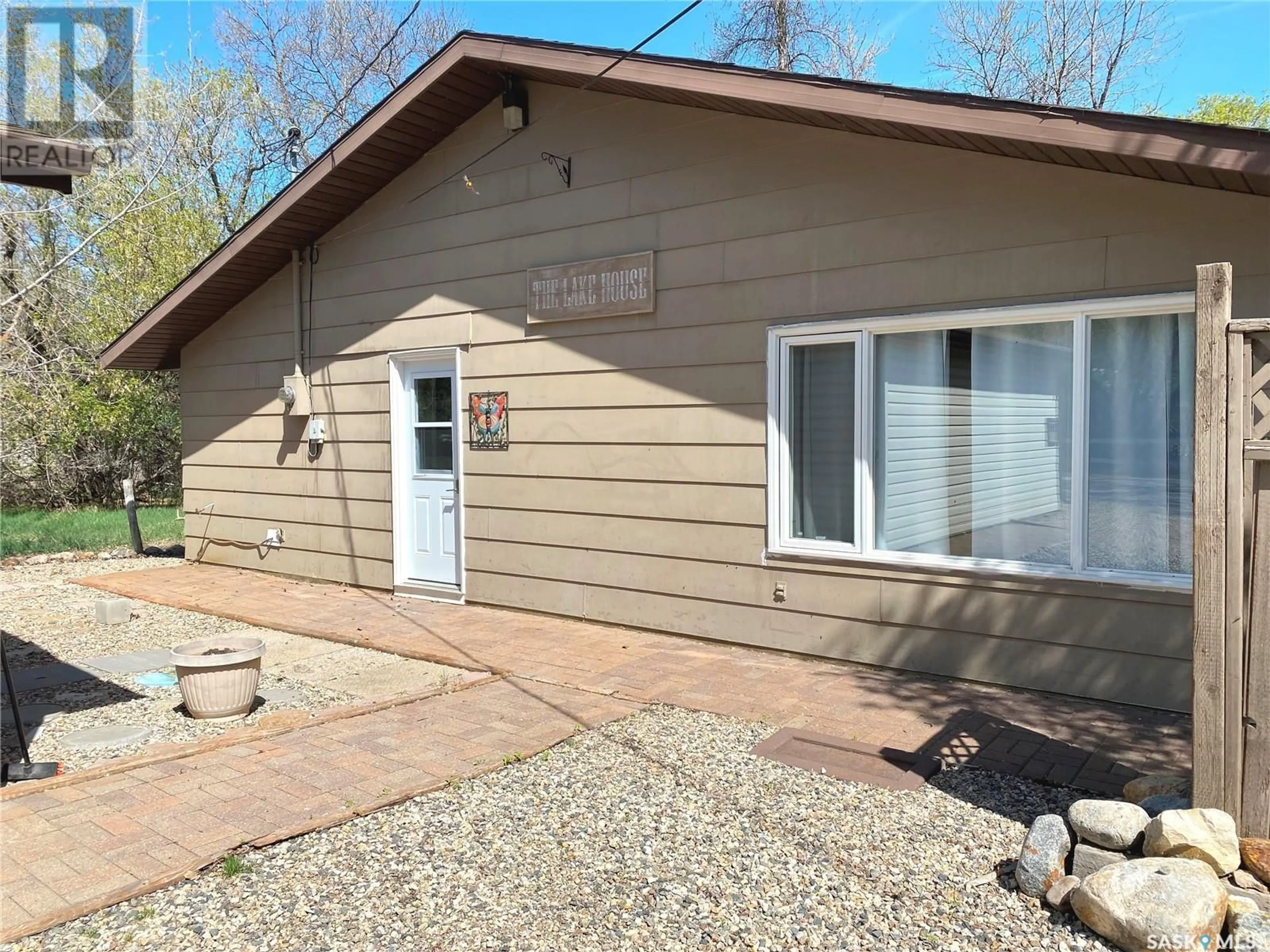 Home with vinyl exterior material, street for 201 LILAC DRIVE, Katepwa Beach Saskatchewan S0G2K0