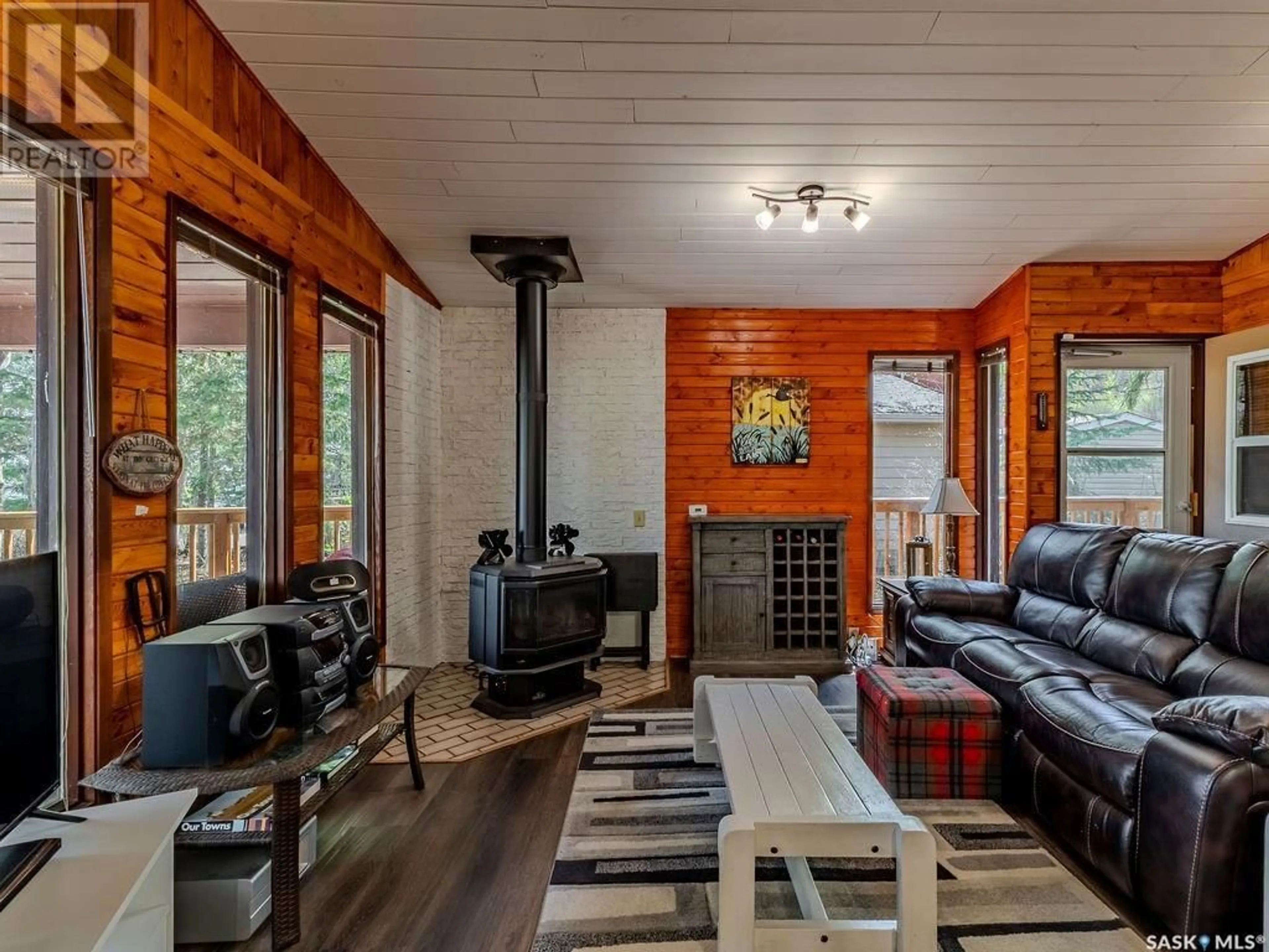 Living room with furniture, wood/laminate floor for 3631 SCHITKA BEACH DR, Wakaw Lake Saskatchewan S0K4P0