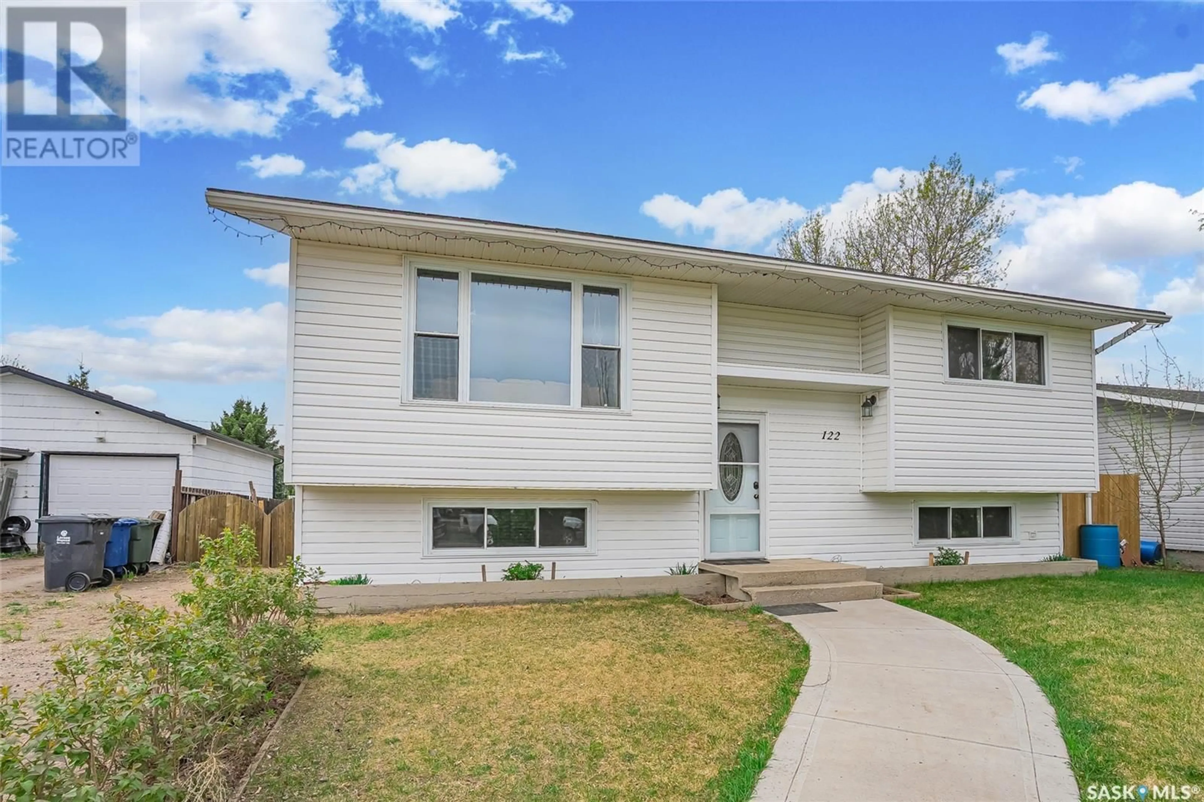 Home with vinyl exterior material, street for 122 JAMES STREET, Langham Saskatchewan S0K2L0