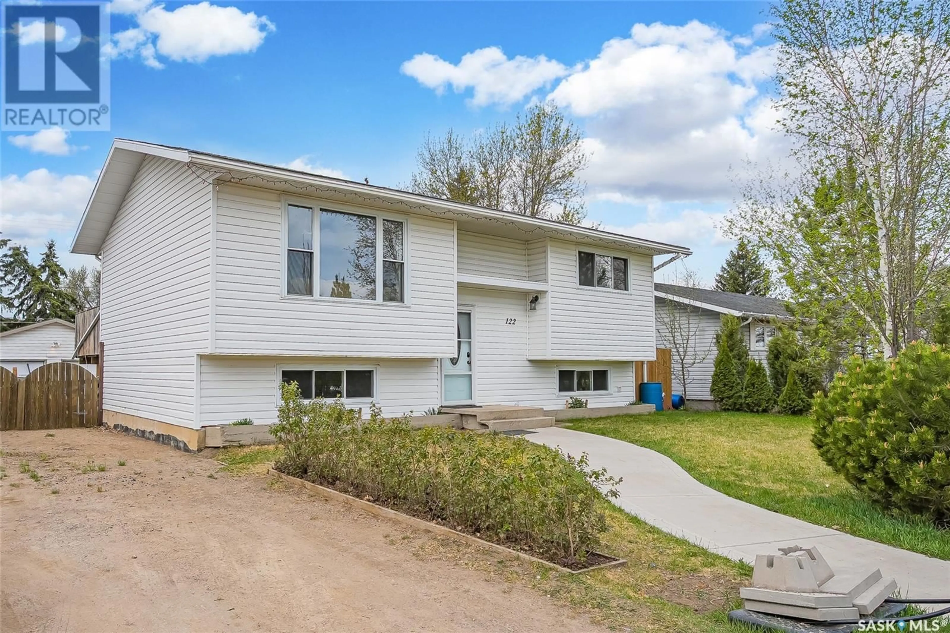 Home with vinyl exterior material, street for 122 JAMES STREET, Langham Saskatchewan S0K2L0