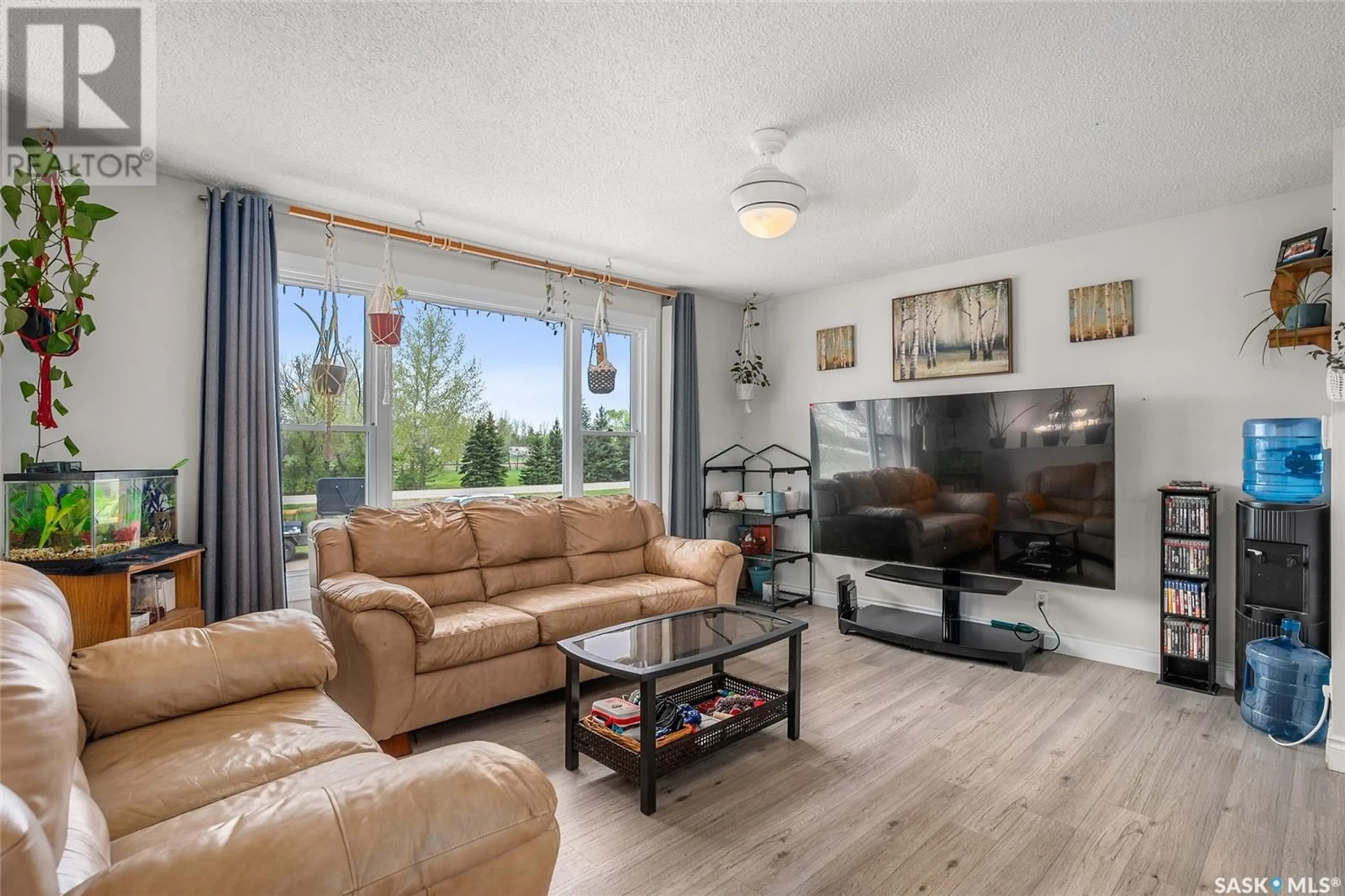 Living room with furniture, wood/laminate floor for 122 JAMES STREET, Langham Saskatchewan S0K2L0