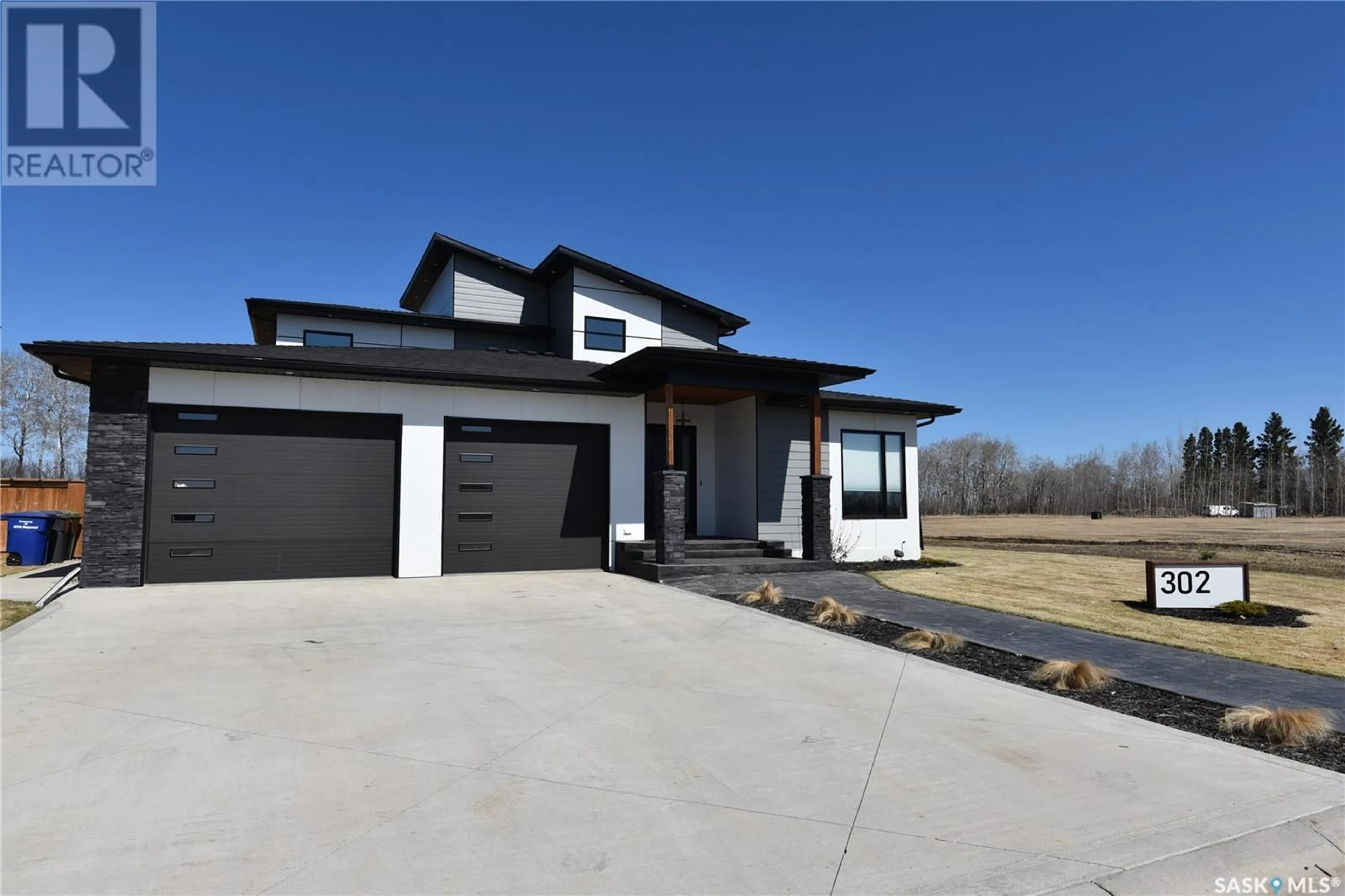 Home with brick exterior material, street for 302 COVENTRY CRESCENT, Nipawin Saskatchewan S0E1E0