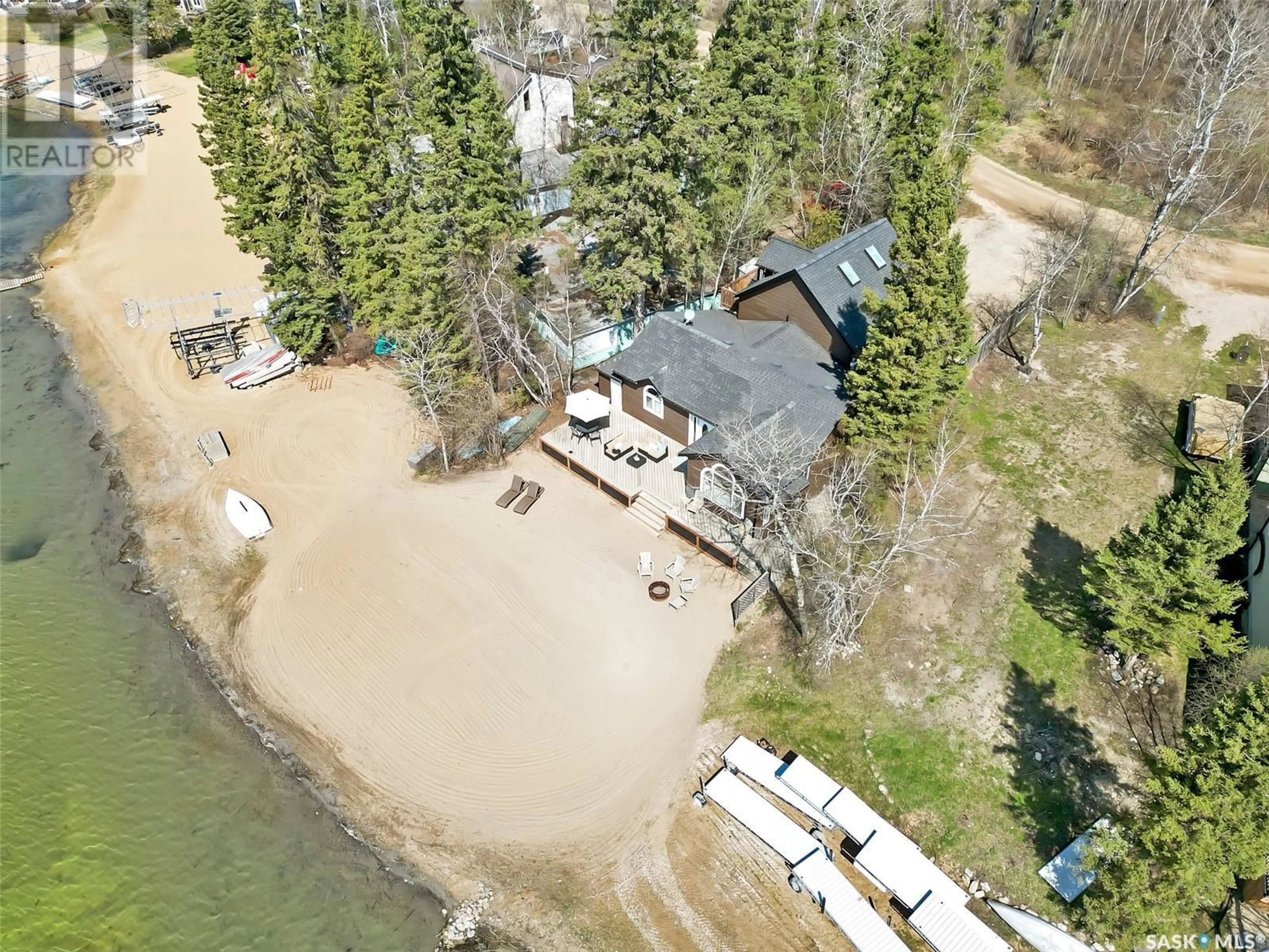 A pic from outside/outdoor area/front of a property/back of a property/a pic from drone, water/lake/river/ocean view for 113 JANICE PLACE, Emma Lake Saskatchewan S0J0N0