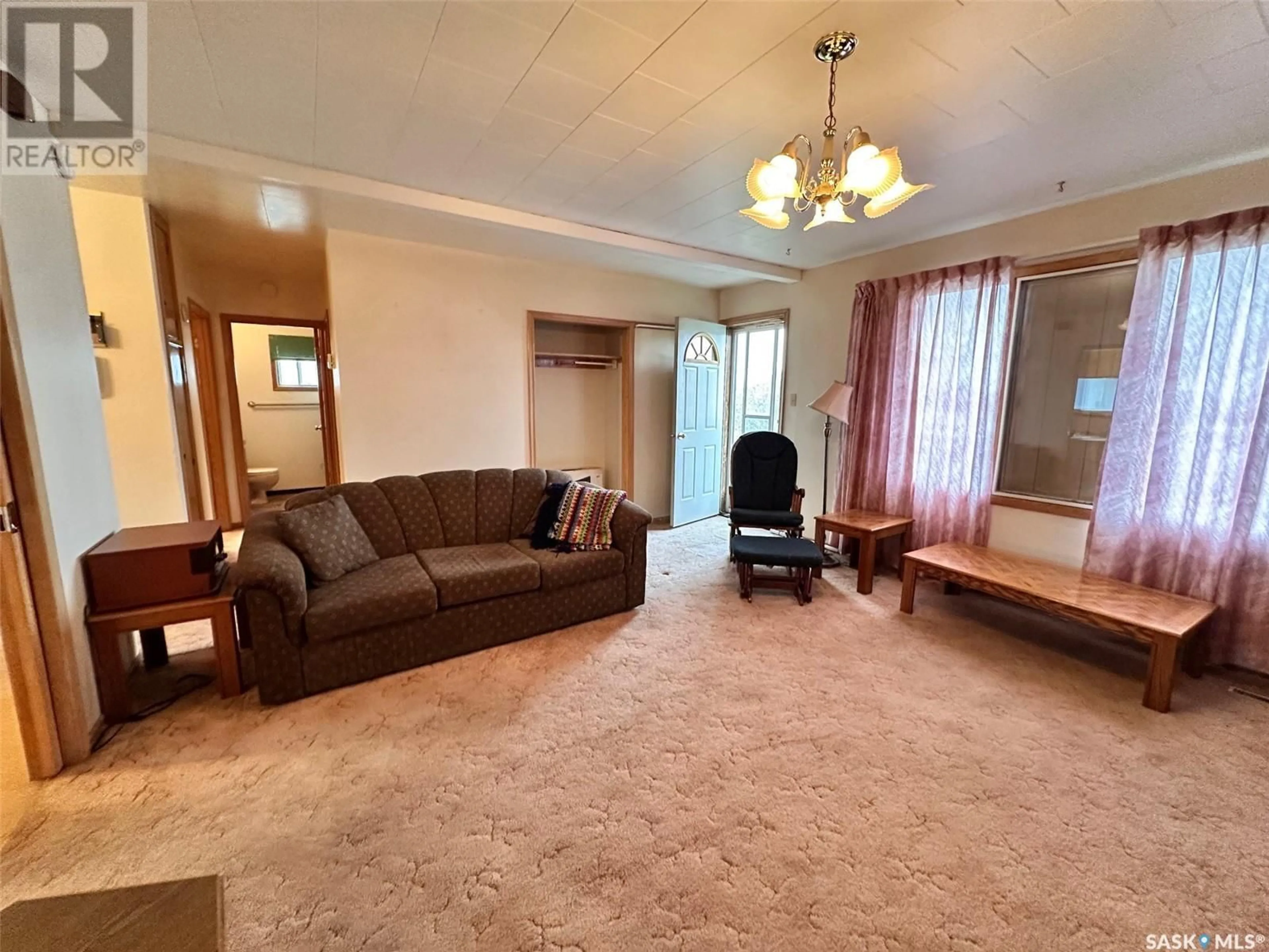Living room with furniture, carpet floor for 216 4TH STREET, Spiritwood Saskatchewan S0J2M0
