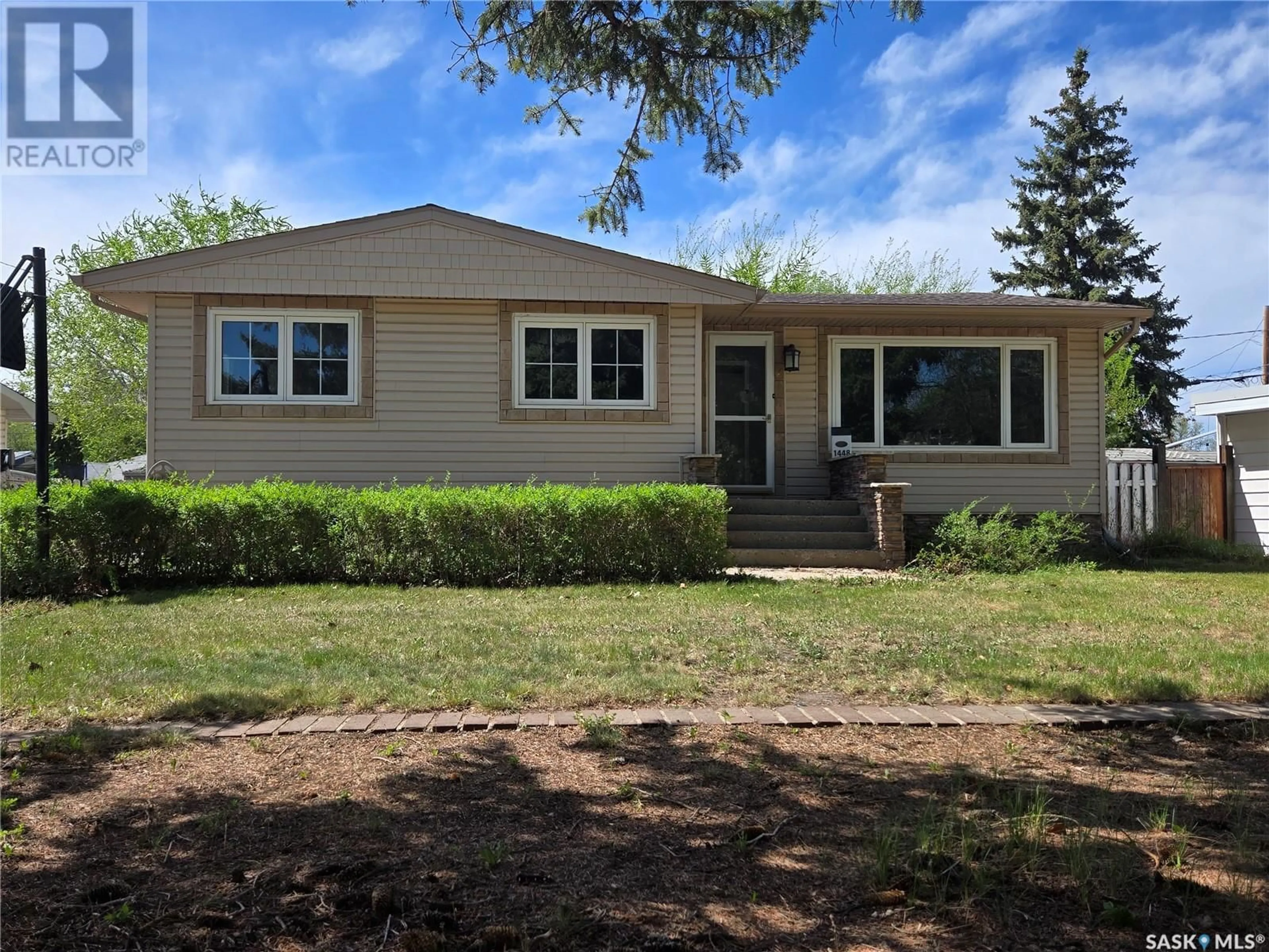 Home with vinyl exterior material, street for 1448 NICHOLSON ROAD, Estevan Saskatchewan S4A1T8
