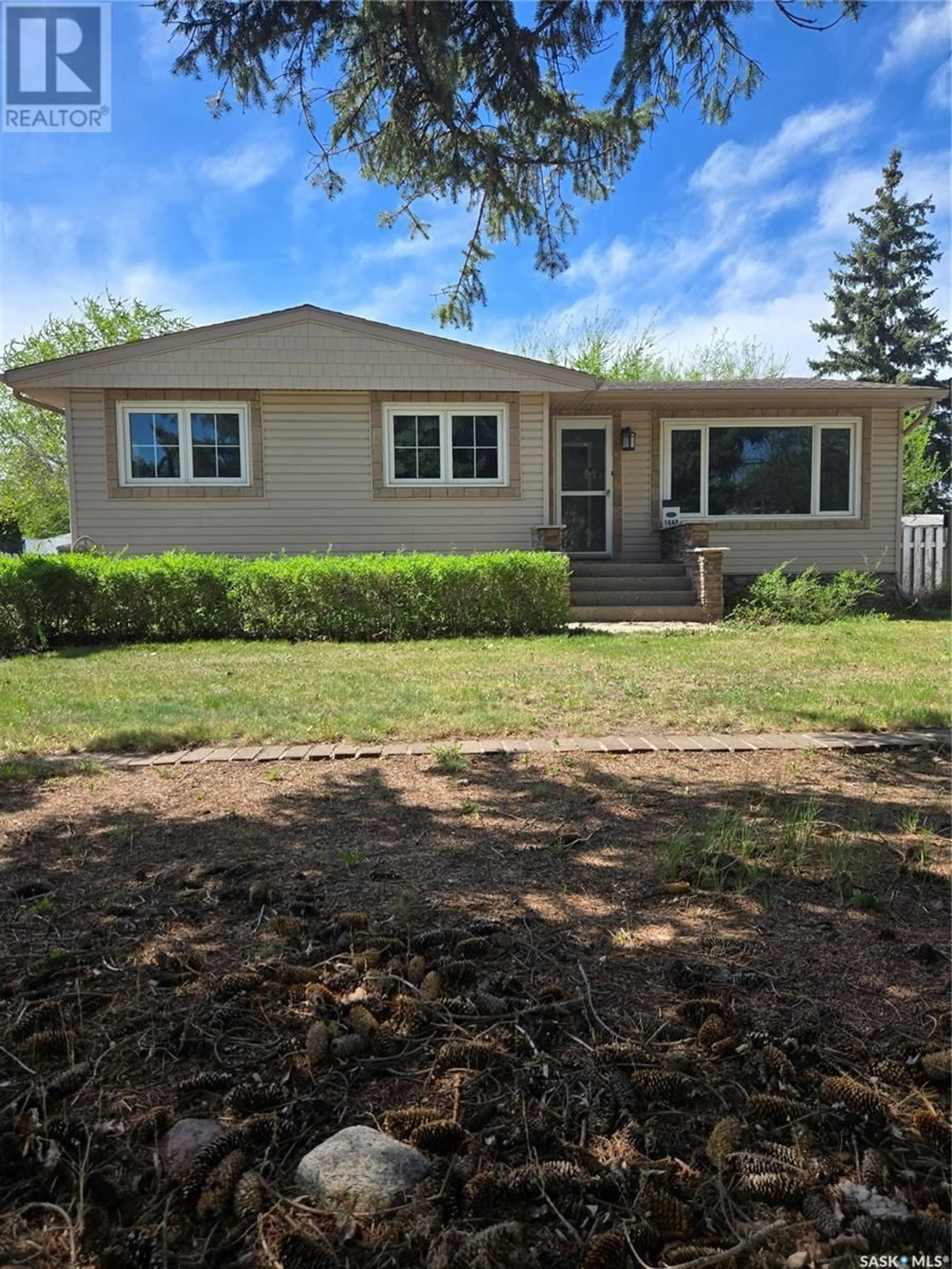 Home with vinyl exterior material, street for 1448 NICHOLSON ROAD, Estevan Saskatchewan S4A1T8