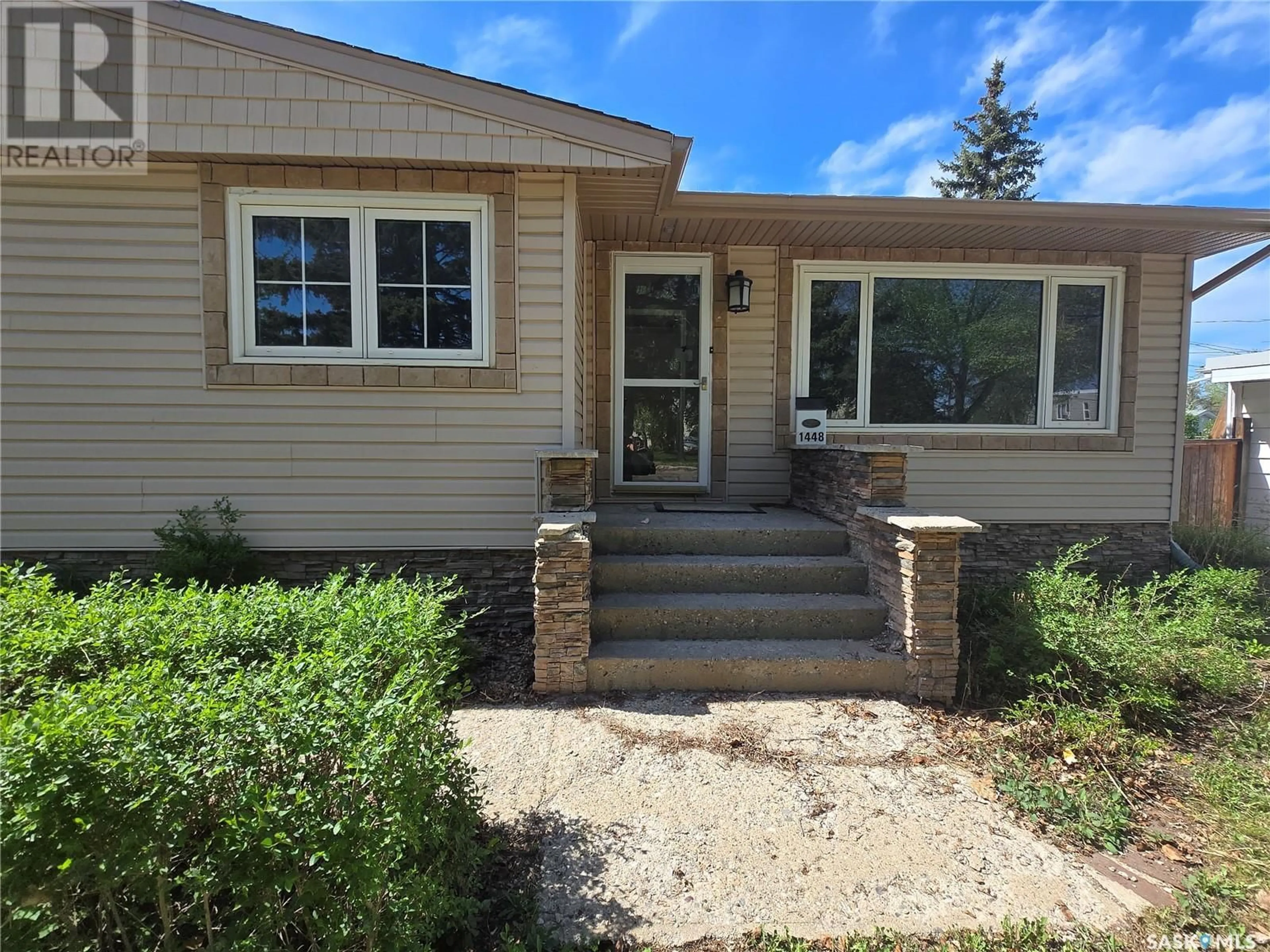 Home with vinyl exterior material, street for 1448 NICHOLSON ROAD, Estevan Saskatchewan S4A1T8