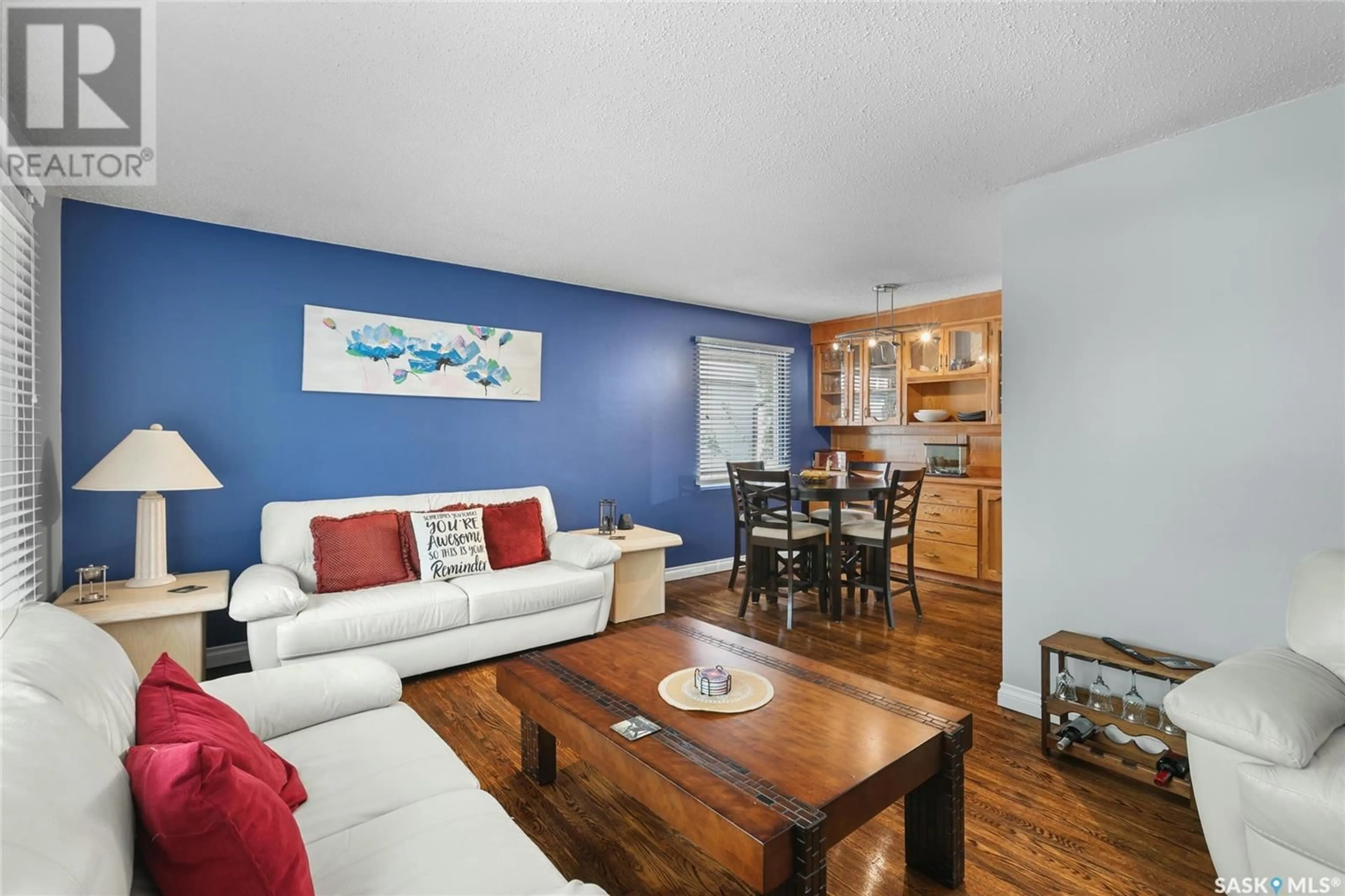 Living room with furniture, wood/laminate floor for 740 HORACE STREET, Regina Saskatchewan S4T5K6