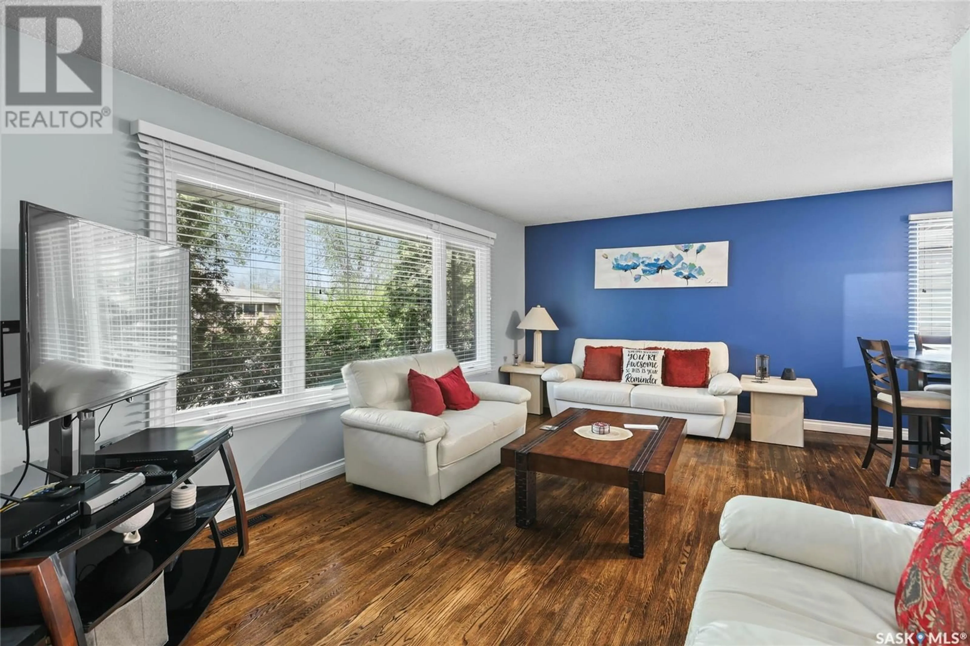 Living room with furniture, wood/laminate floor for 740 HORACE STREET, Regina Saskatchewan S4T5K6