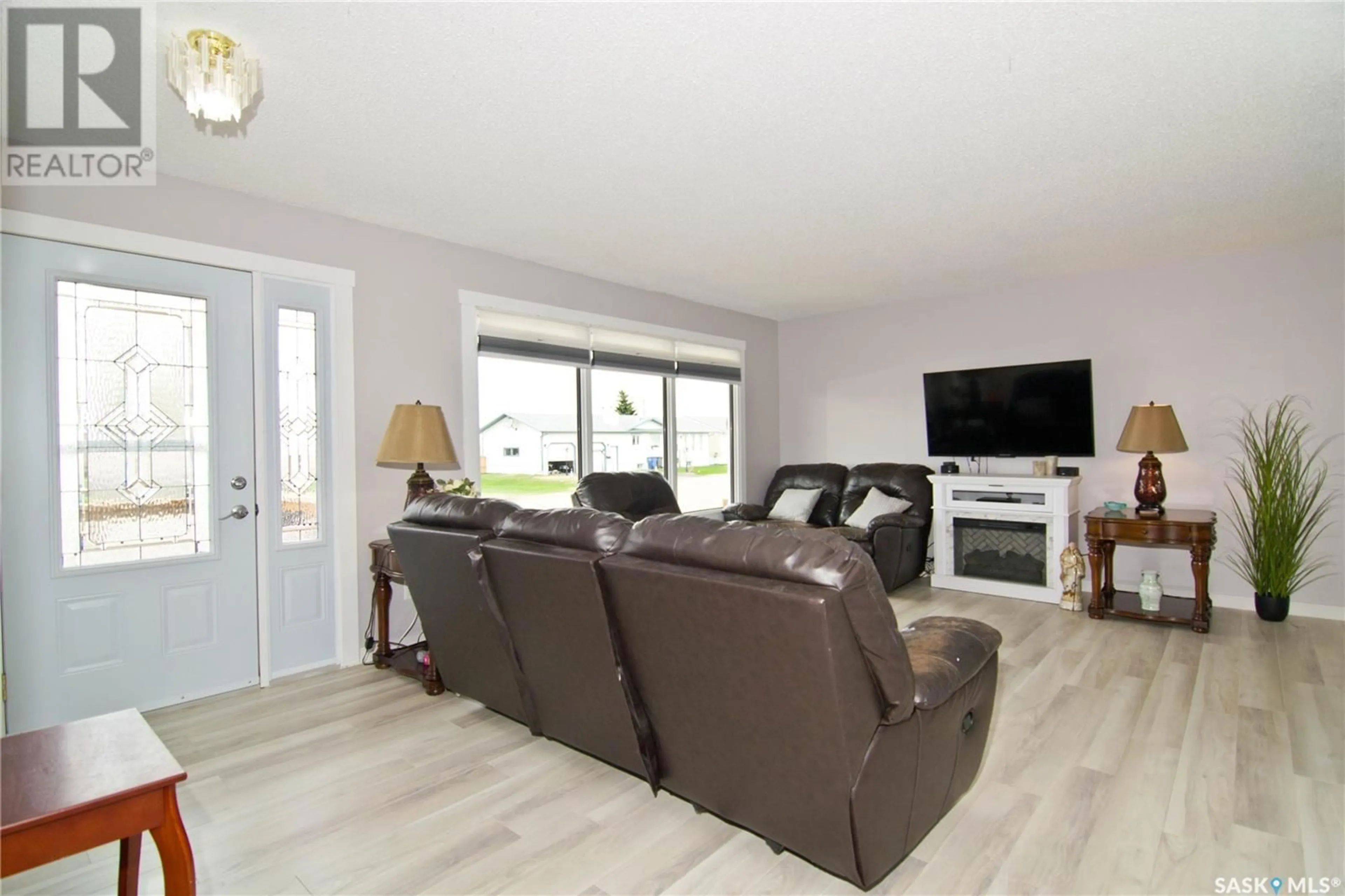 Living room with furniture, wood/laminate floor for 403 2ND AVENUE, Montmartre Rm No. 126 Saskatchewan S0G3M0