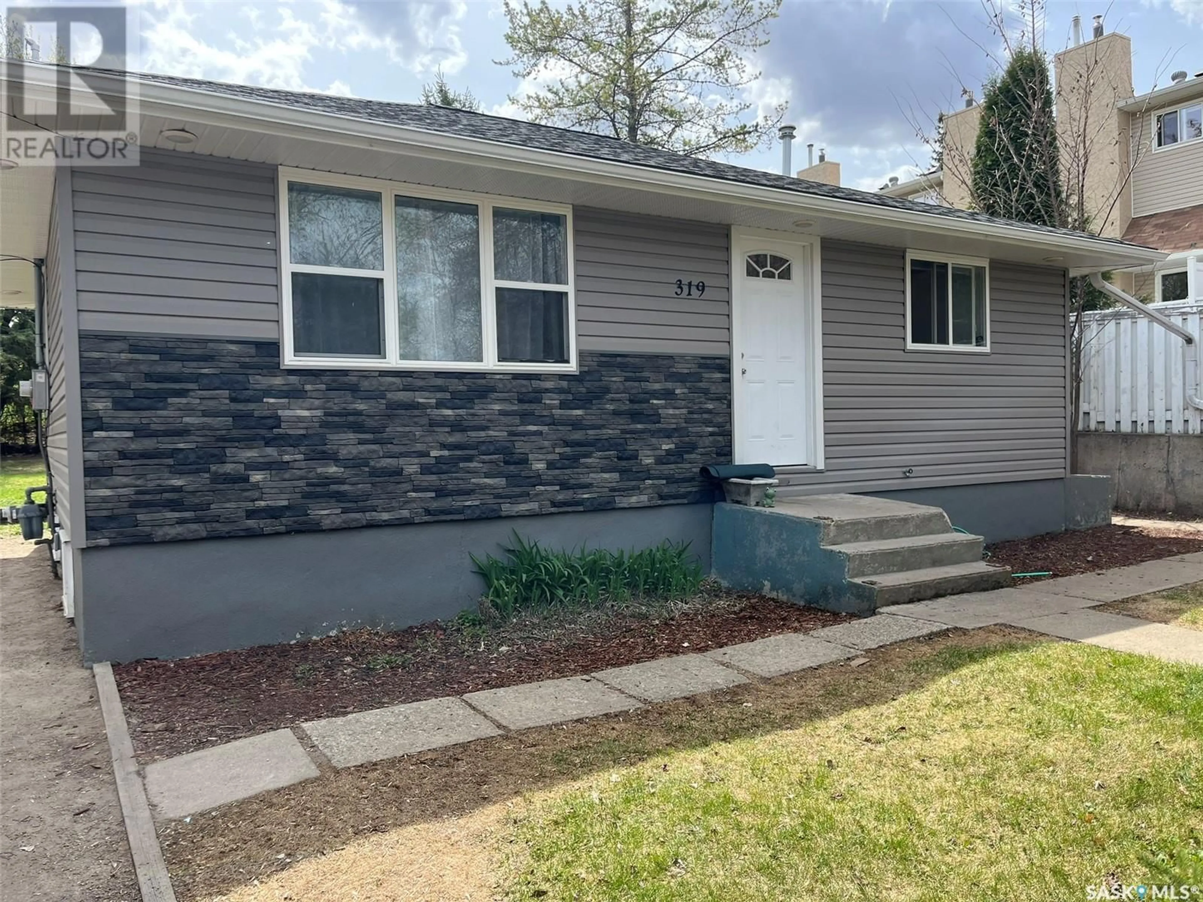Home with vinyl exterior material, street for 319 19TH STREET, Prince Albert Saskatchewan S6V1J8