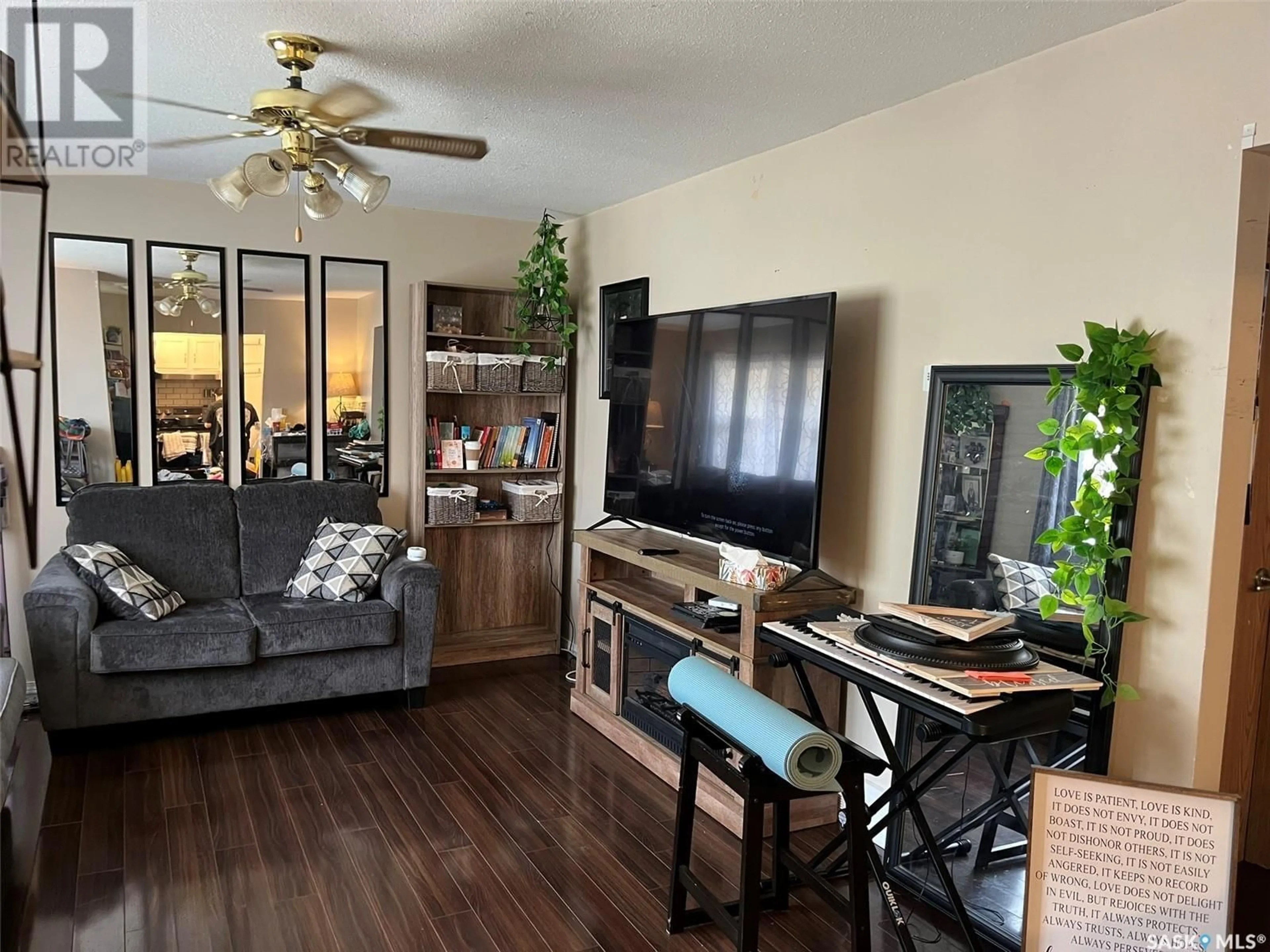 Living room with furniture, wood/laminate floor for 319 19TH STREET, Prince Albert Saskatchewan S6V1J8