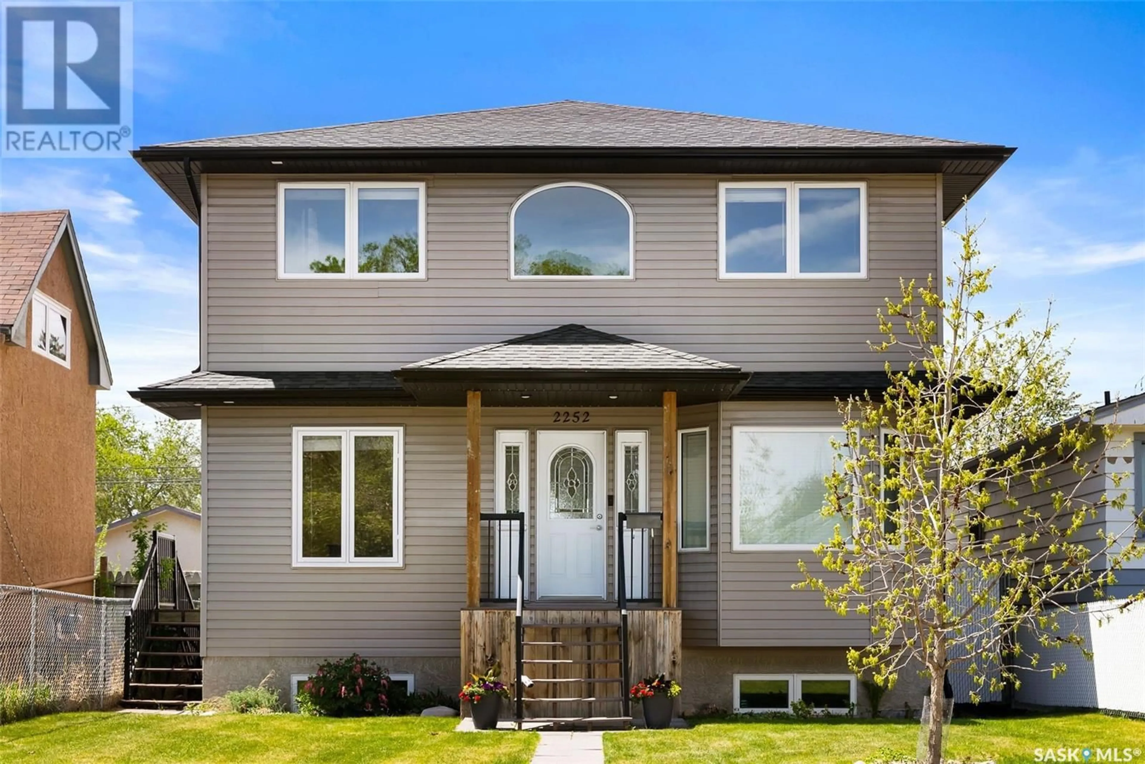 Home with vinyl exterior material, street for 2252 MCDONALD STREET, Regina Saskatchewan S4N2Y8