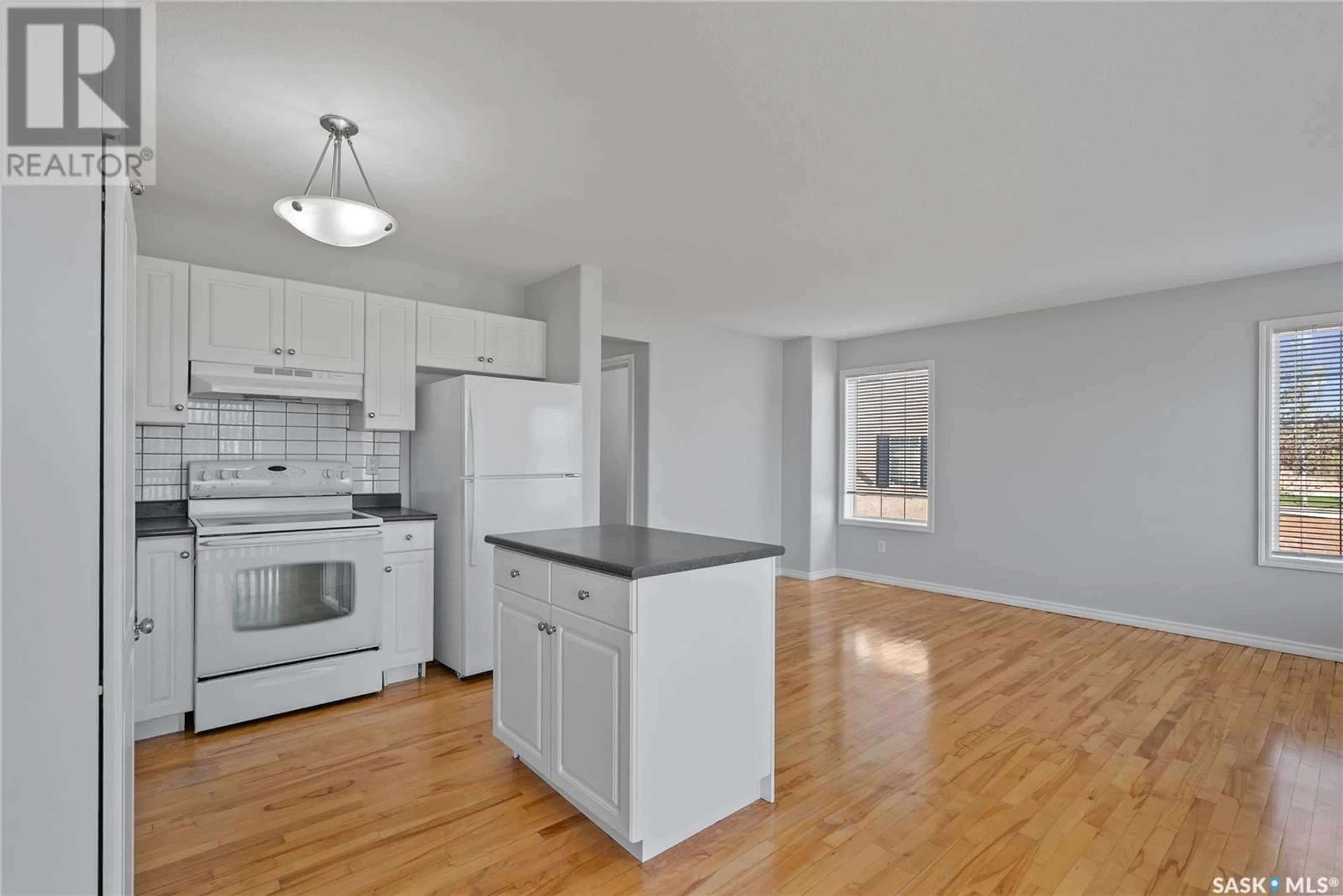 Open concept kitchen, wood/laminate floor for 58 127 BANYAN CRESCENT, Saskatoon Saskatchewan S7V1G5