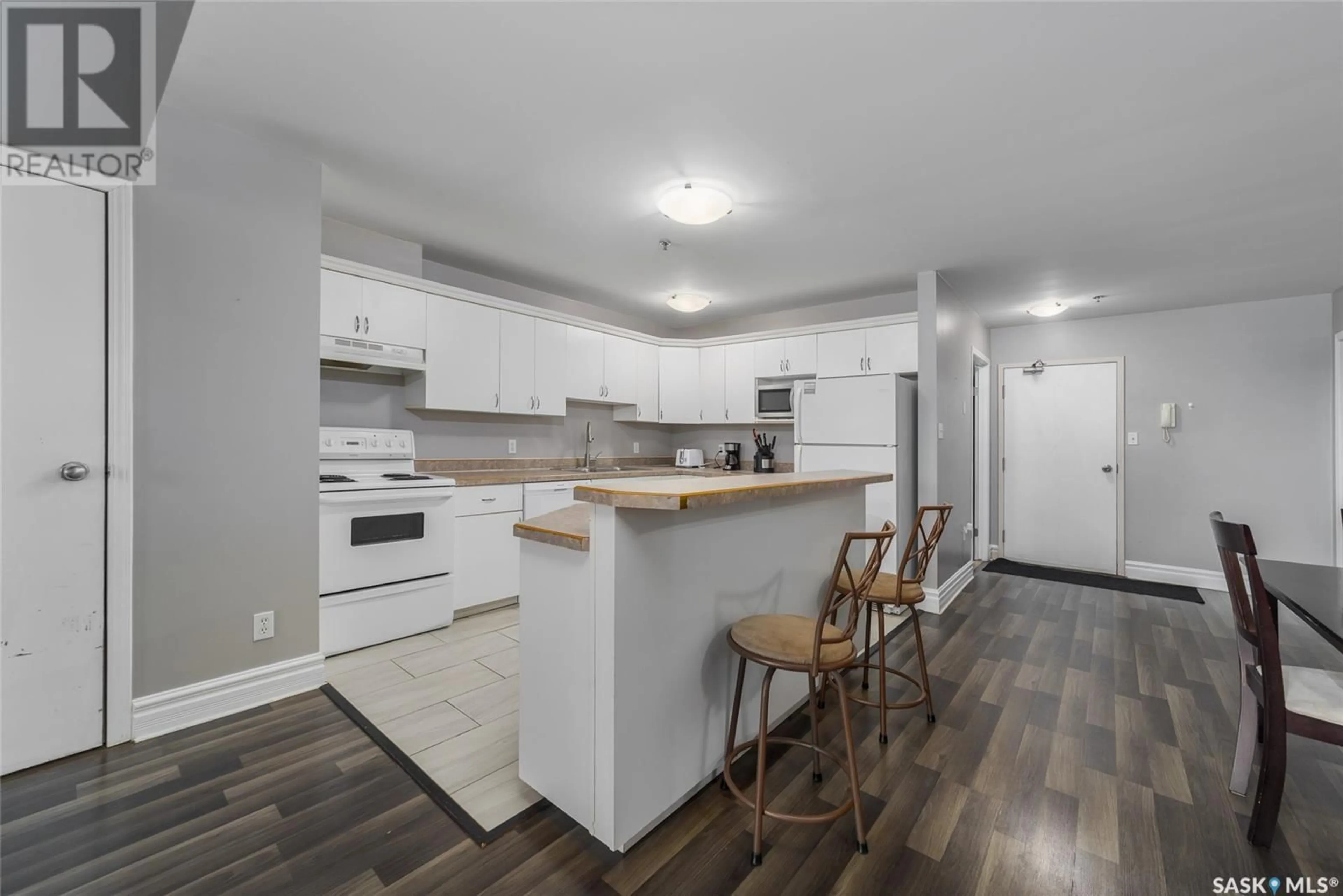 Open concept kitchen, wood/laminate floor for 404 1839 SCARTH STREET, Regina Saskatchewan S4P2G9