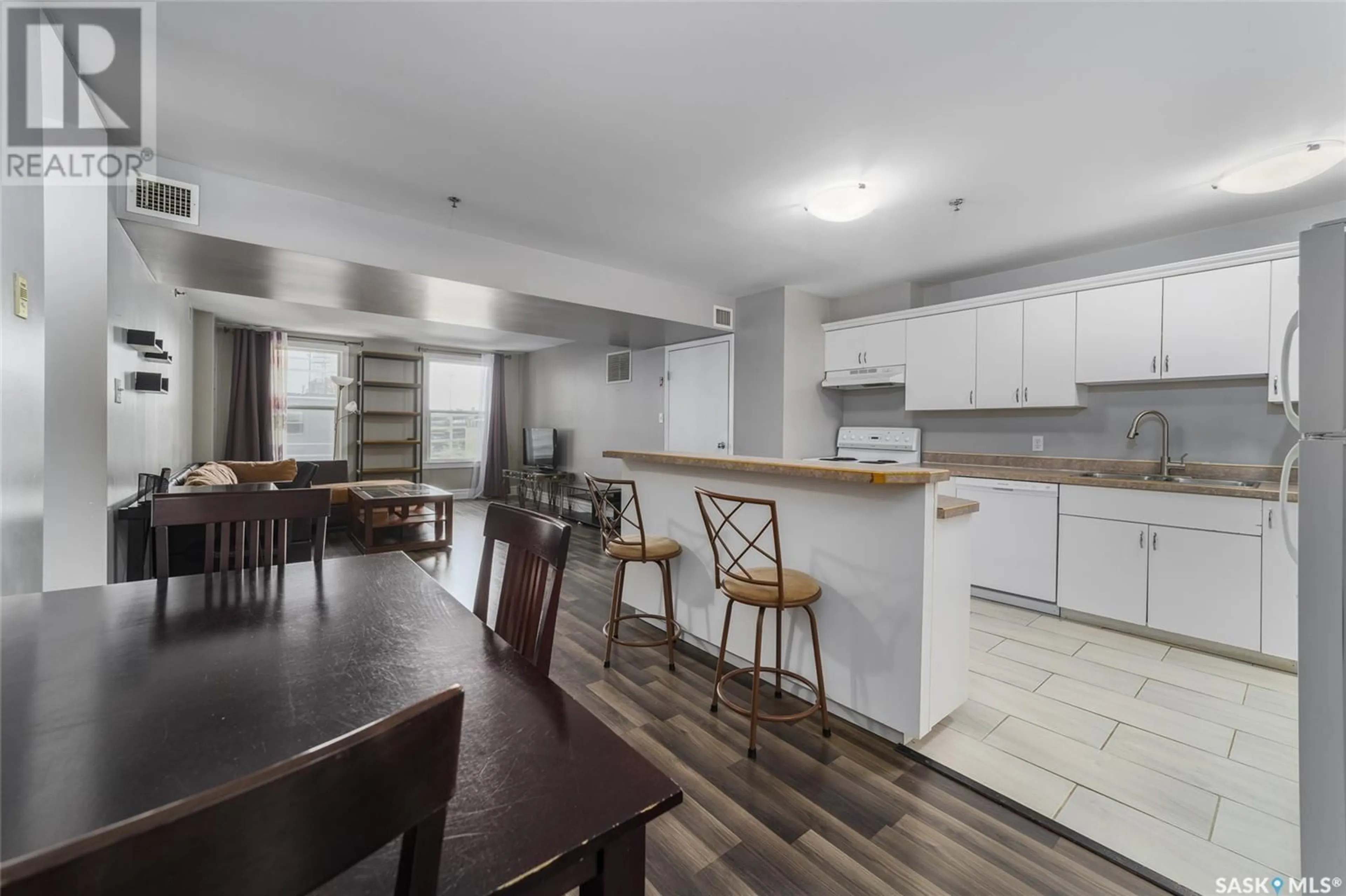 Open concept kitchen, wood/laminate floor for 404 1839 SCARTH STREET, Regina Saskatchewan S4P2G9