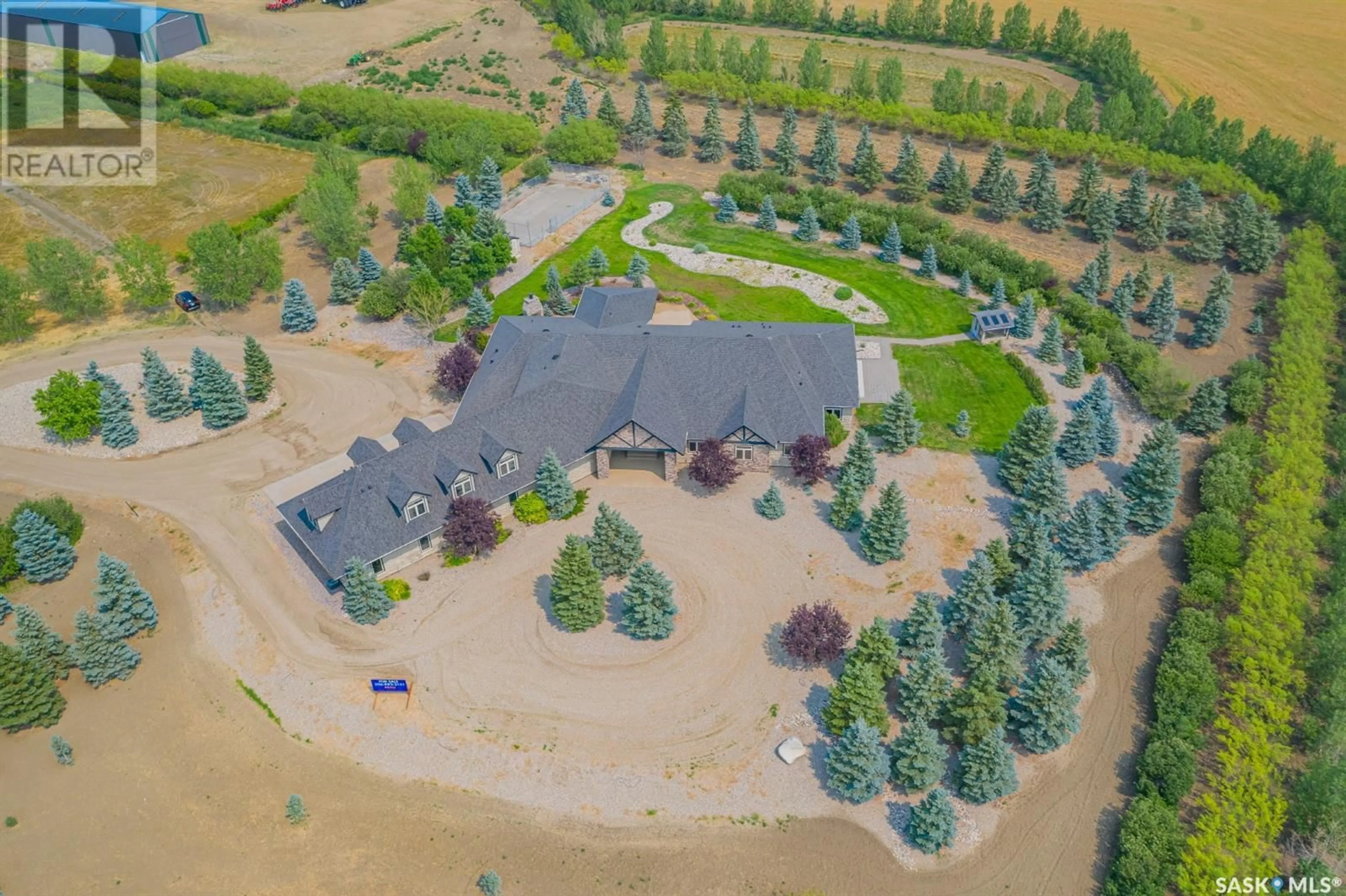 A pic from outside/outdoor area/front of a property/back of a property/a pic from drone, forest/trees view for 112 4 HIGHWAY S, Rosetown Saskatchewan S0L2V0