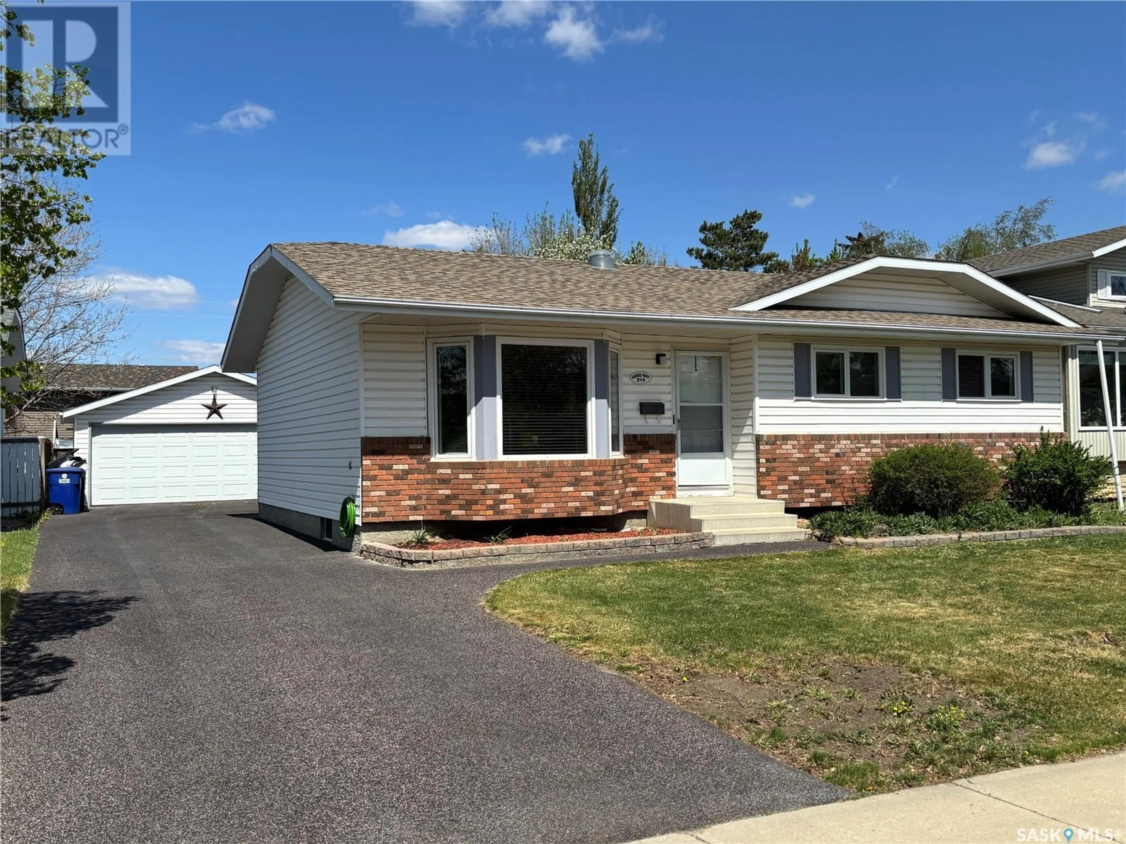 Home with vinyl exterior material, street for 215 HOGG WAY, Saskatoon Saskatchewan S7N3W4