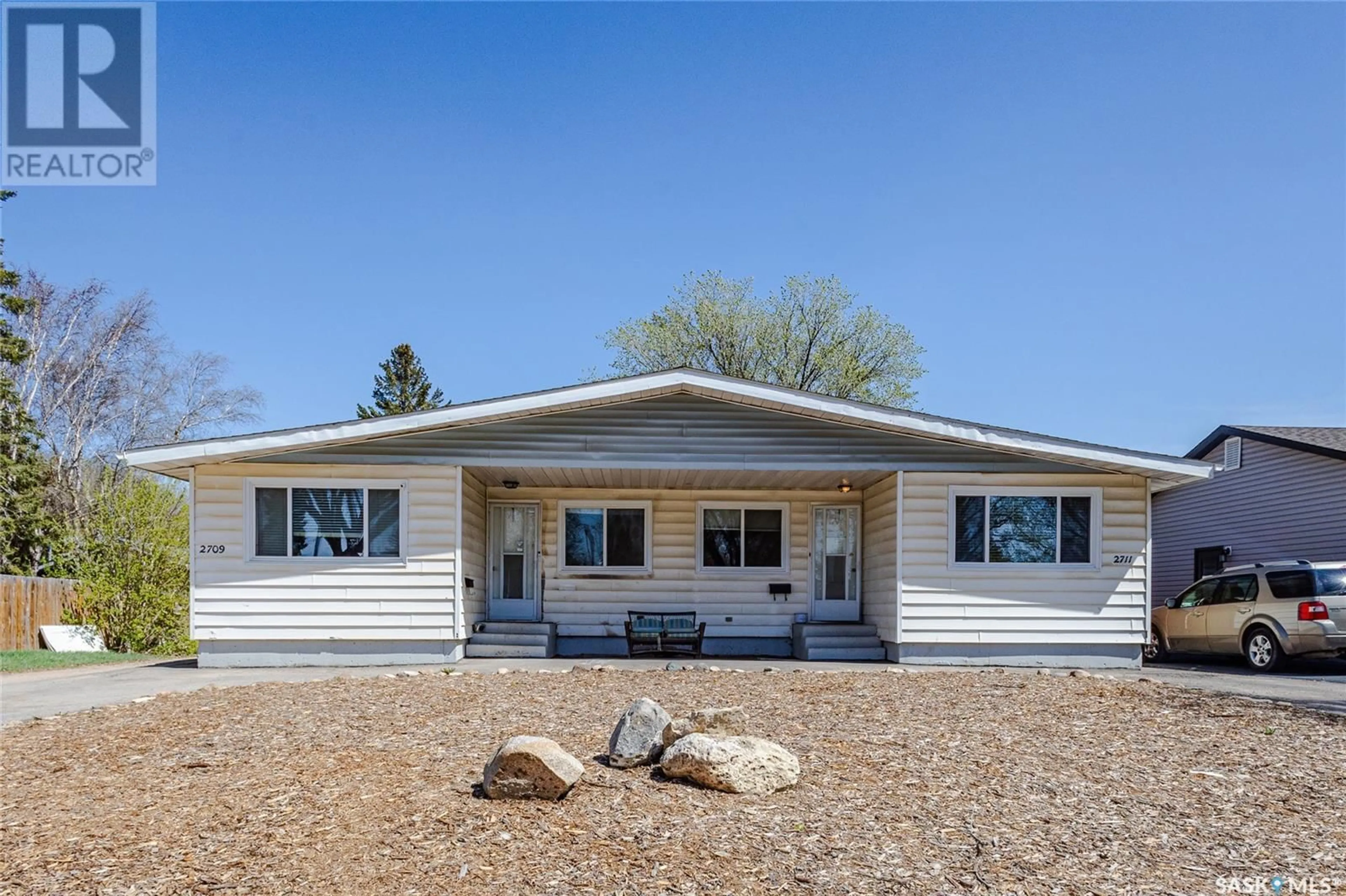 Home with vinyl exterior material, unknown for 2709-2711 PRESTON AVENUE, Saskatoon Saskatchewan S7J2G7
