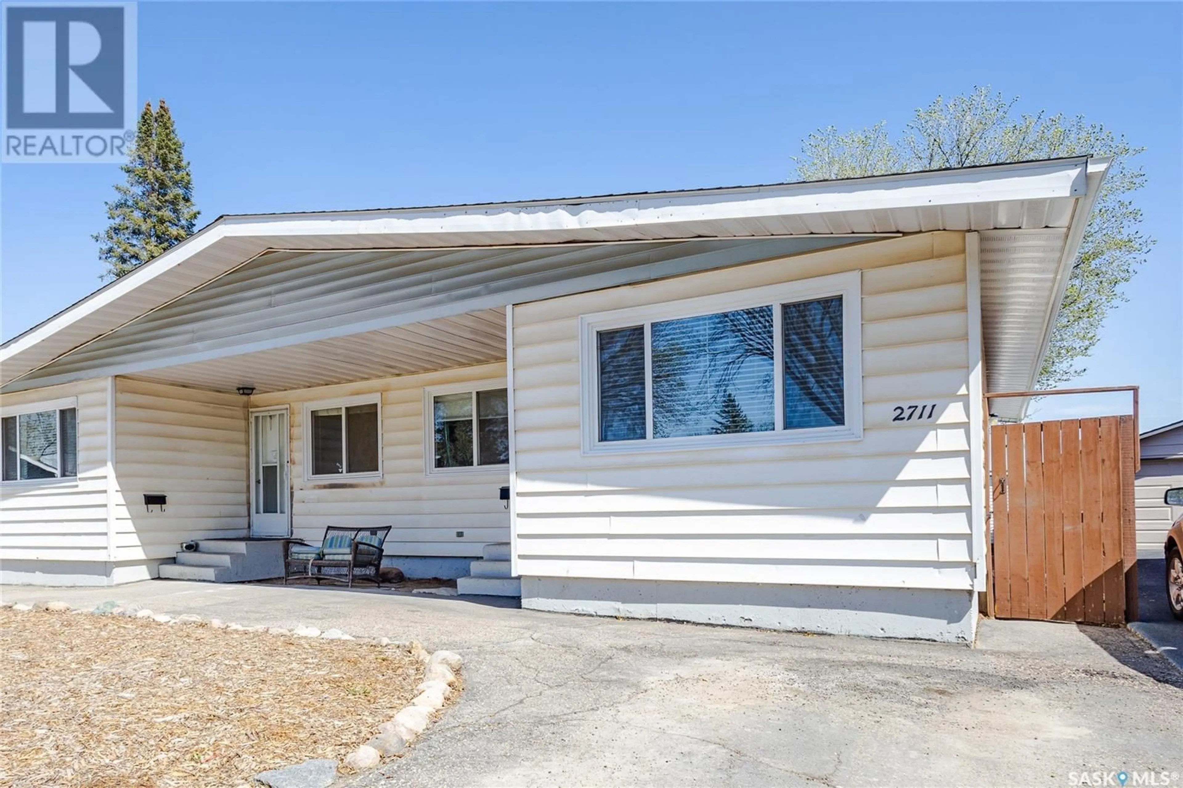Home with vinyl exterior material, street for 2709-2711 PRESTON AVENUE, Saskatoon Saskatchewan S7J2G7