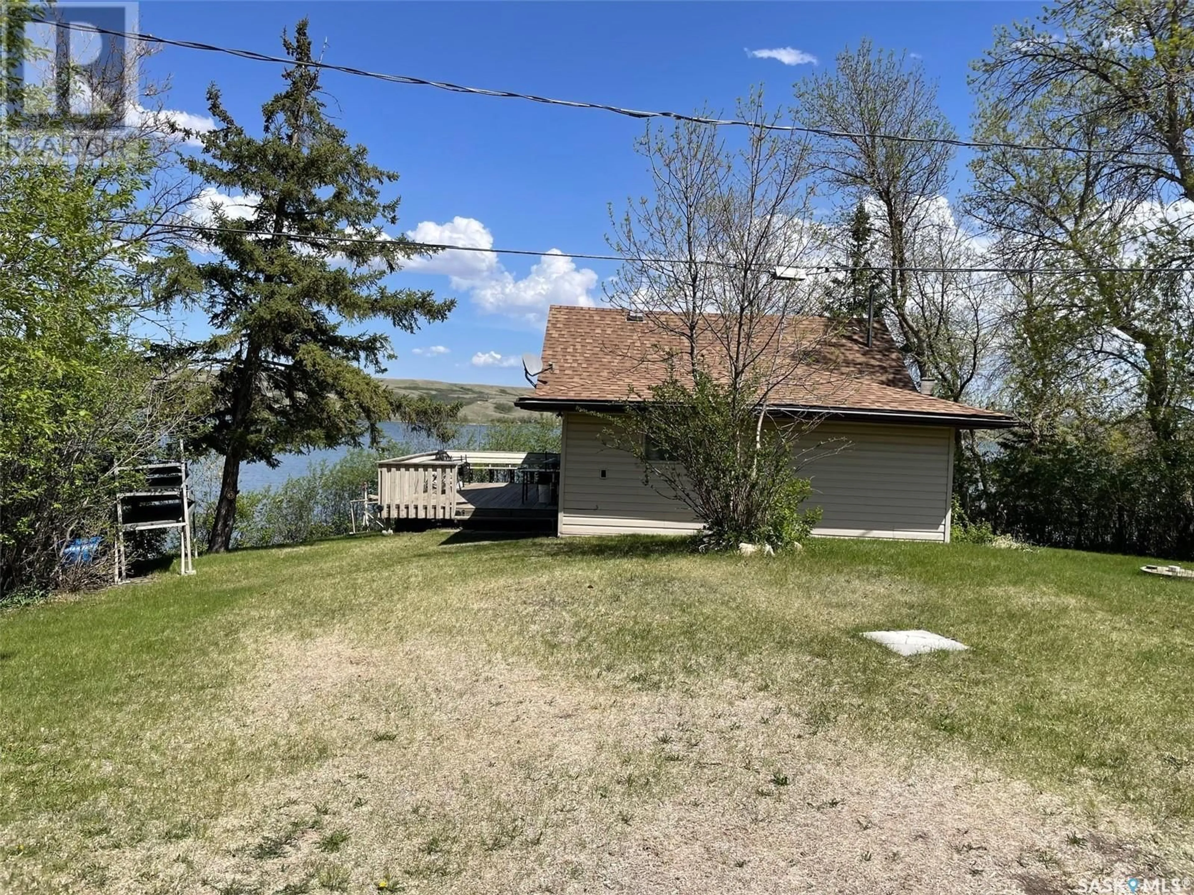 A pic from outside/outdoor area/front of a property/back of a property/a pic from drone, water/lake/river/ocean view for 1220 TATANKA DRIVE, Sun Valley Saskatchewan S0G1P0