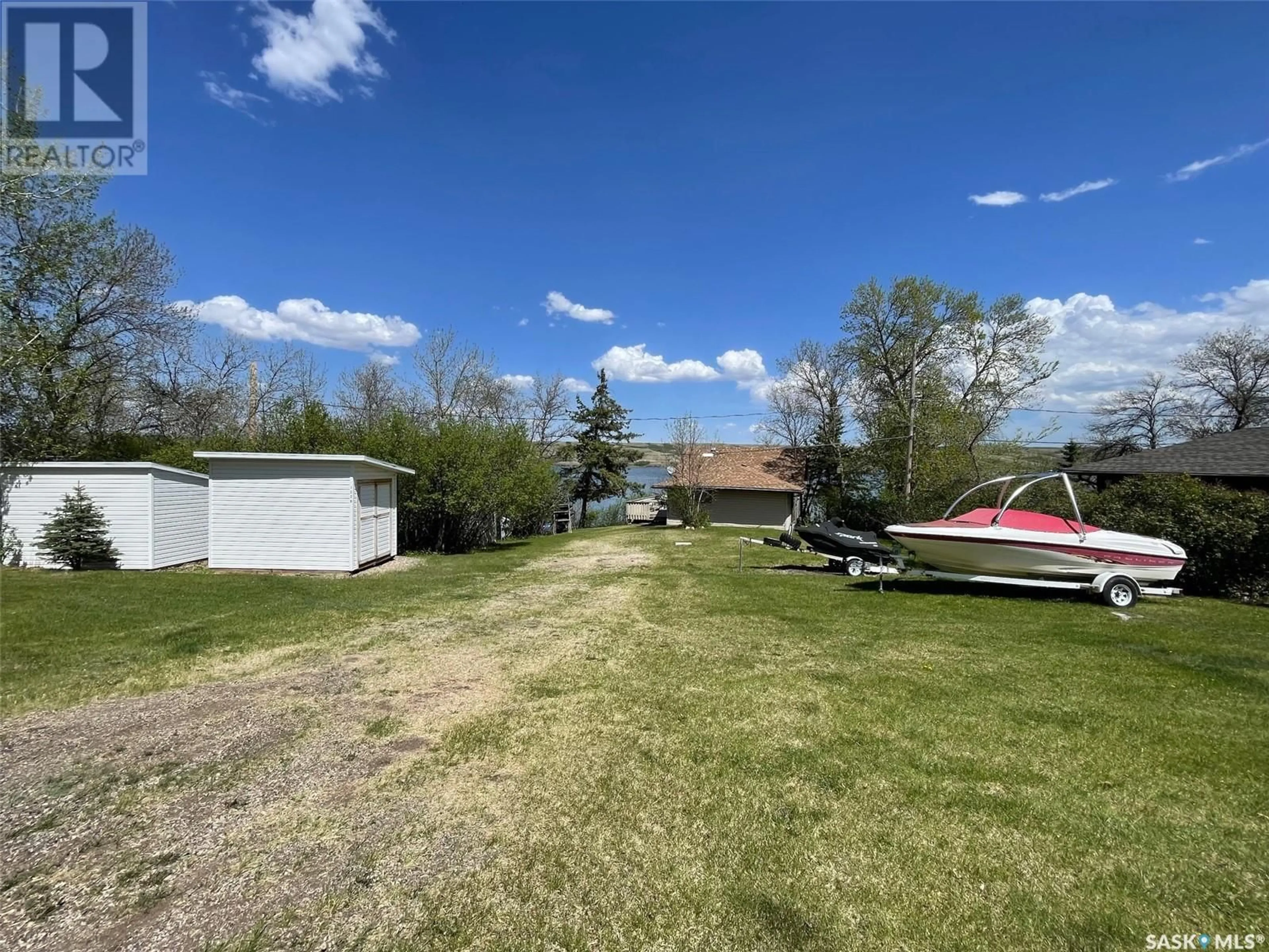 A pic from outside/outdoor area/front of a property/back of a property/a pic from drone, water/lake/river/ocean view for 1220 TATANKA DRIVE, Sun Valley Saskatchewan S0G1P0