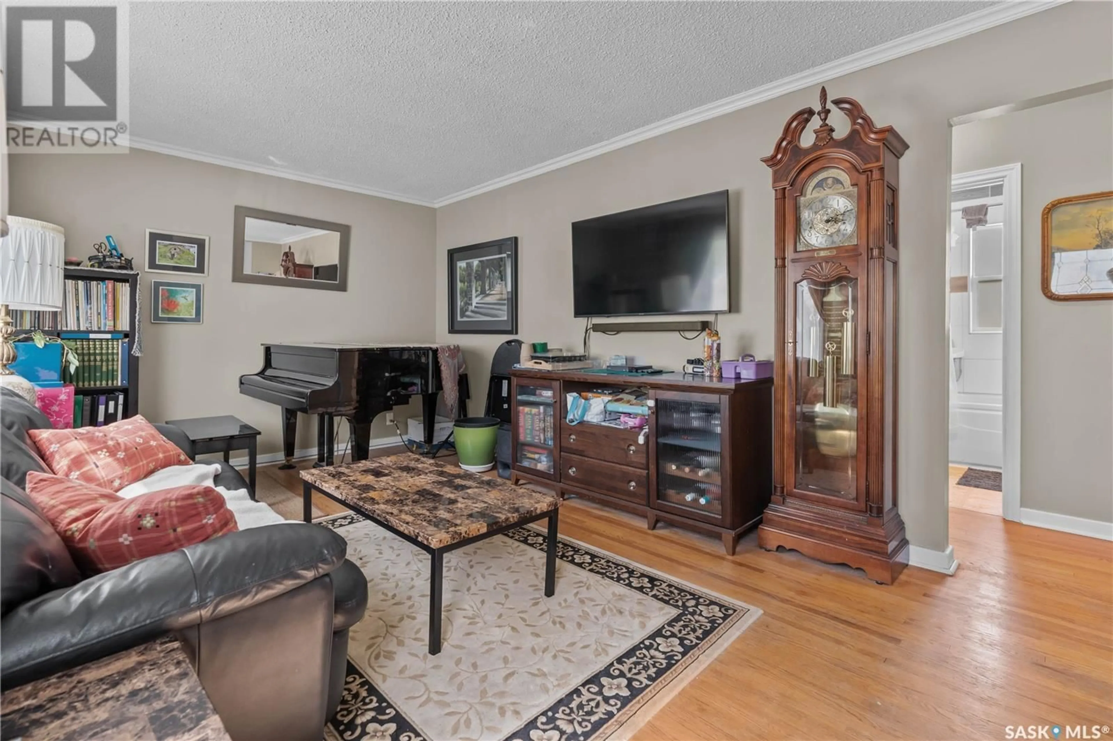 Living room with furniture, wood/laminate floor for 841 ROYAL STREET, Regina Saskatchewan S4T4Z5