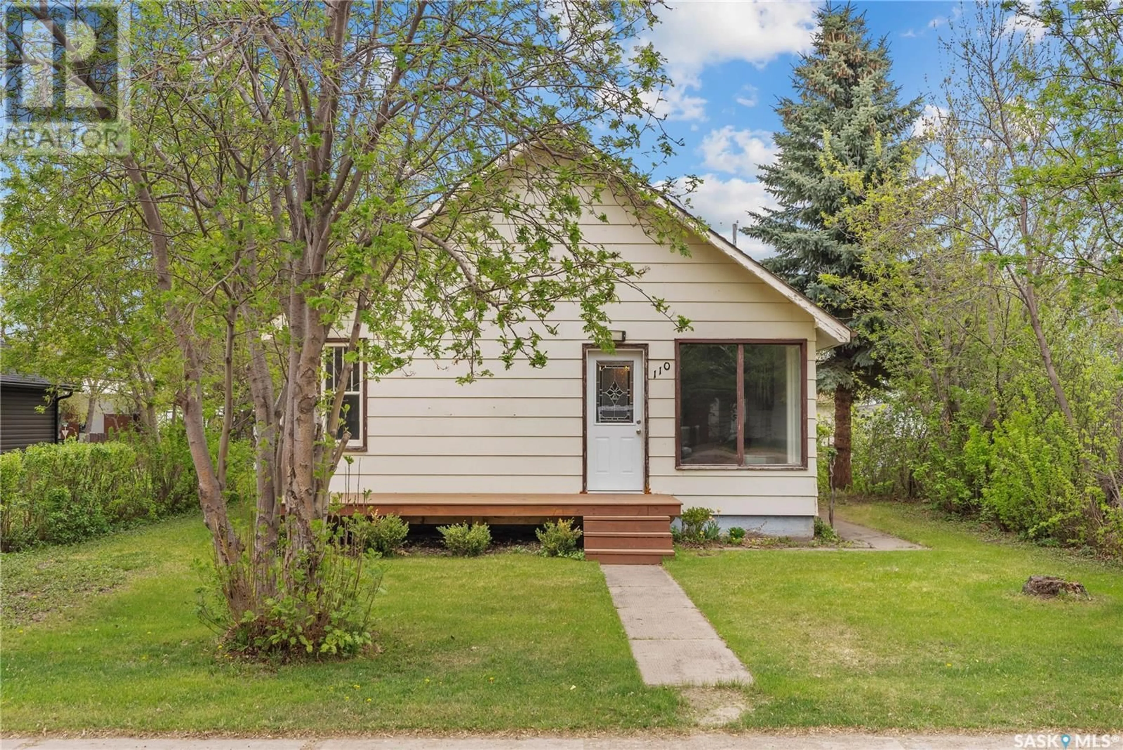 Home with vinyl exterior material, street for 110 3RD STREET, Wakaw Saskatchewan S0K4P0