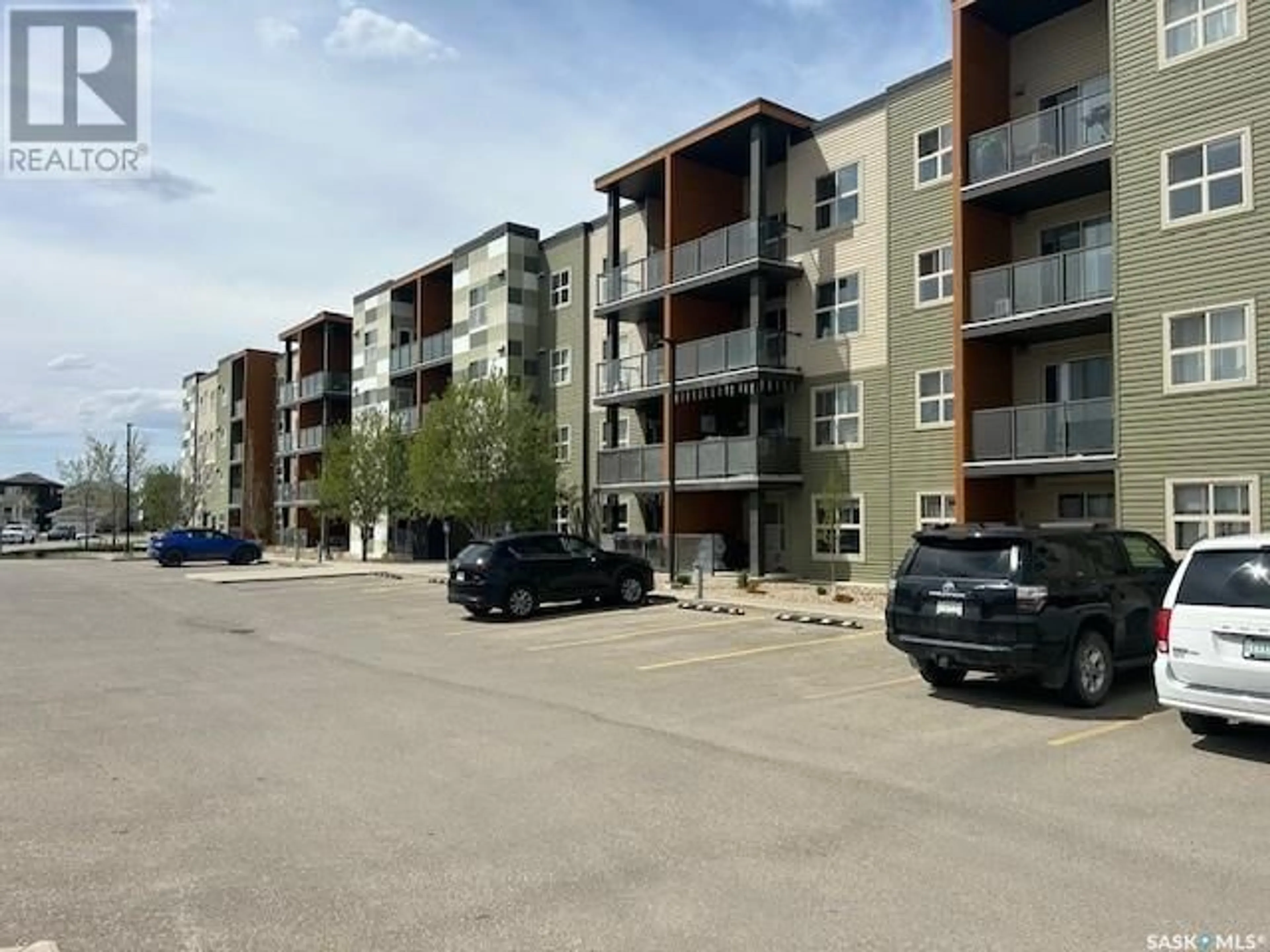 A pic from outside/outdoor area/front of a property/back of a property/a pic from drone, street for 5500 - 2306 MITCHINSON WAY, Regina Saskatchewan S4W0N9