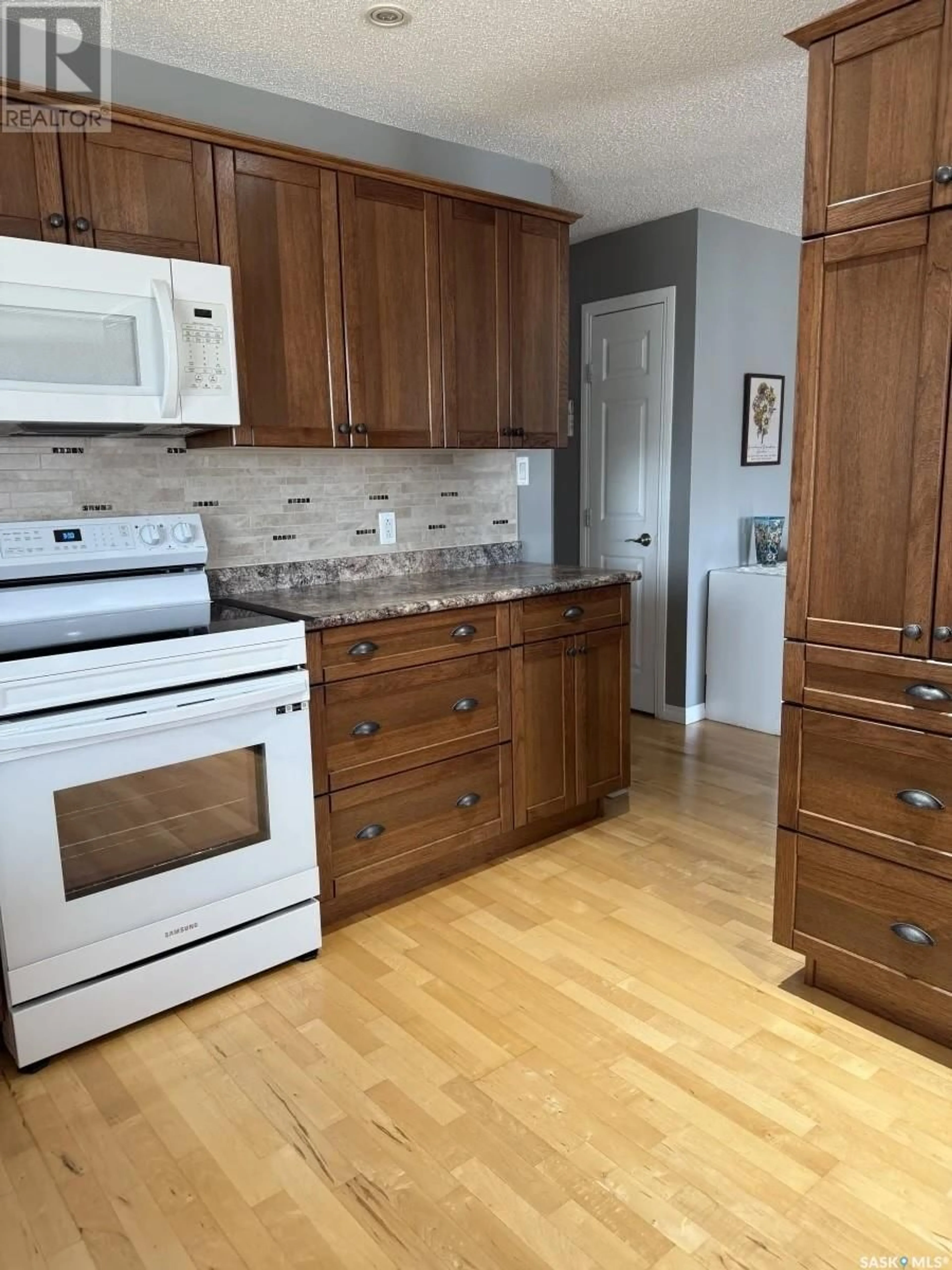 Standard kitchen, wood/laminate floor for 1 VALECREST PLACE, Tisdale Saskatchewan S0E1T0