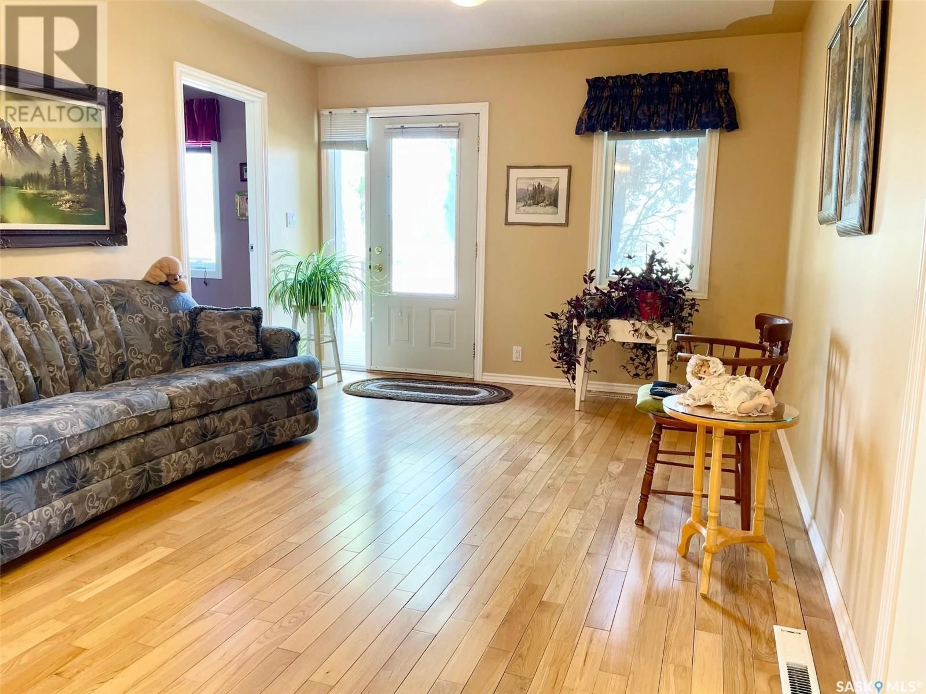 Living room with furniture, wood/laminate floor for 305 SECOND AVENUE, Melville Saskatchewan S0A2P0