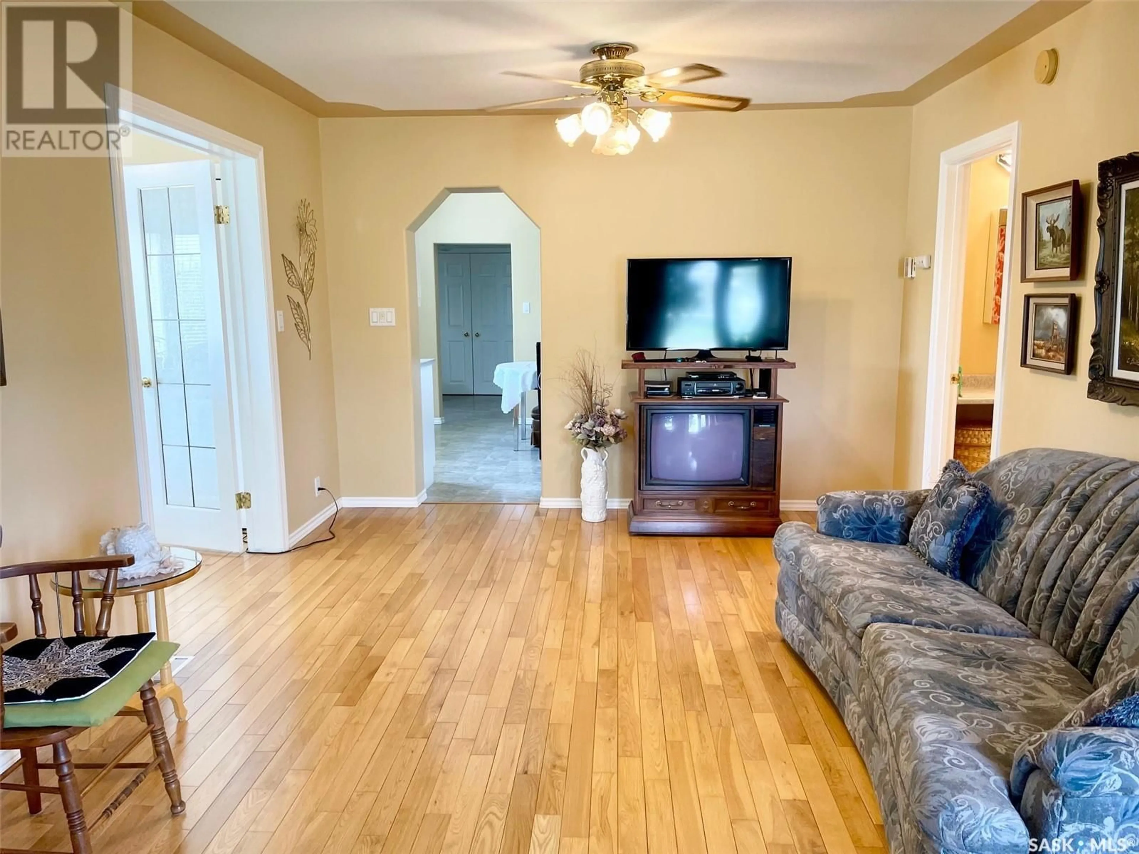 Living room with furniture, wood/laminate floor for 305 SECOND AVENUE, Melville Saskatchewan S0A2P0