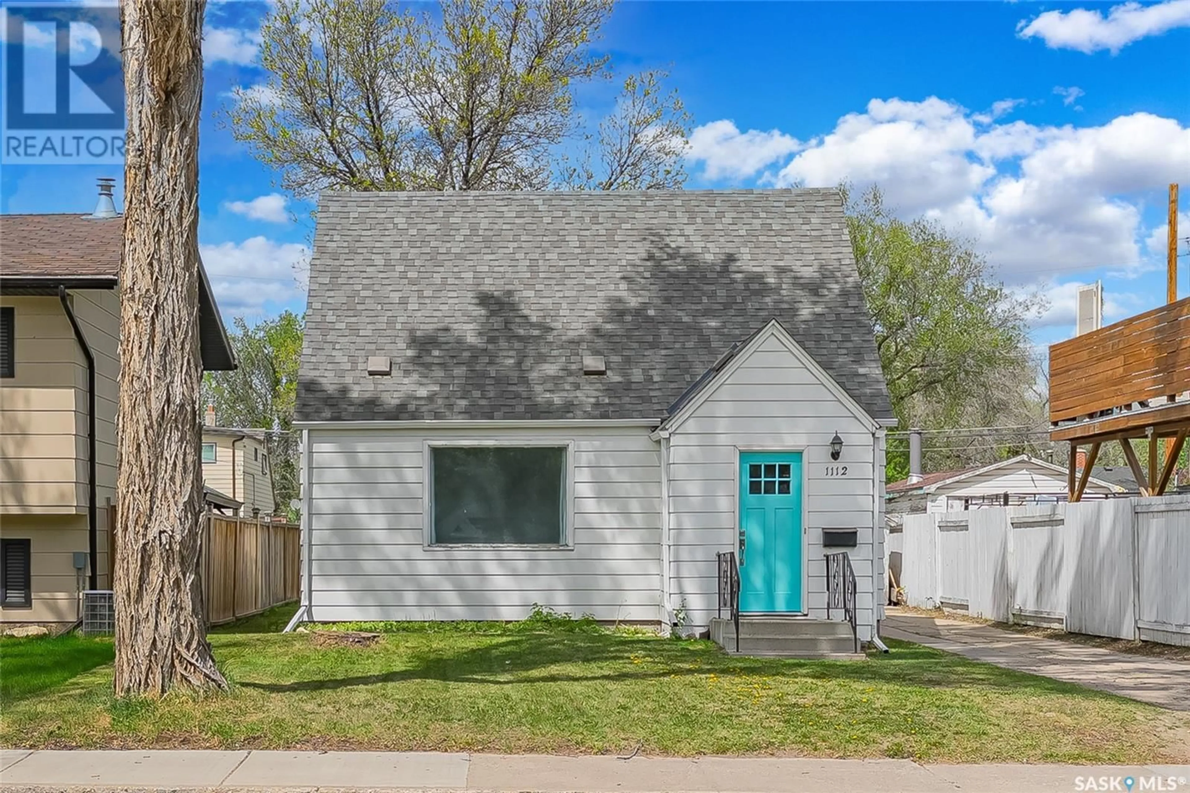 Home with vinyl exterior material, street for 1112 33RD STREET, Saskatoon Saskatchewan S7K0S8