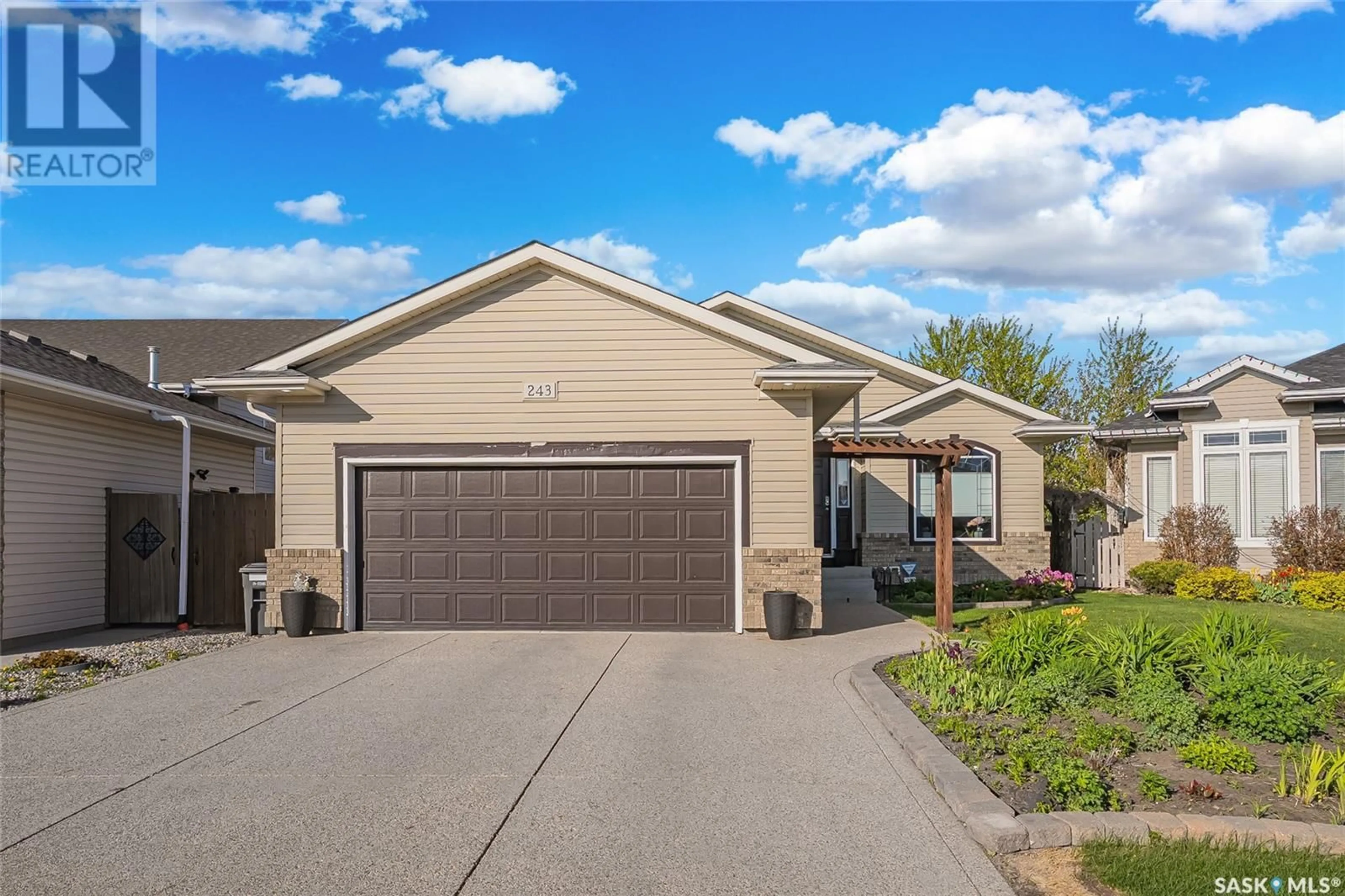 Home with vinyl exterior material, street for 243 KUCEY TERRACE, Saskatoon Saskatchewan S7N4T1