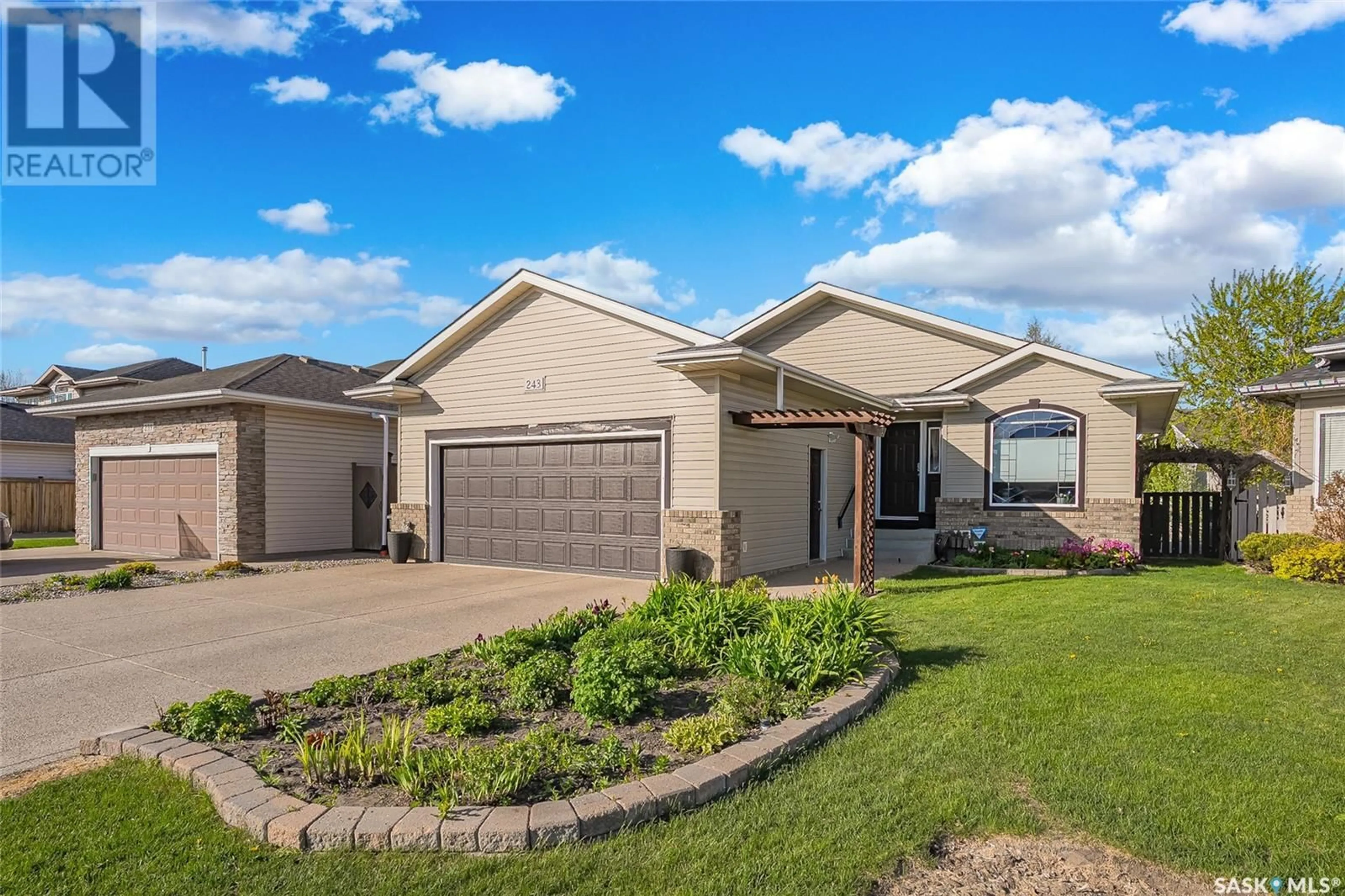 Home with brick exterior material, street for 243 KUCEY TERRACE, Saskatoon Saskatchewan S7N4T1