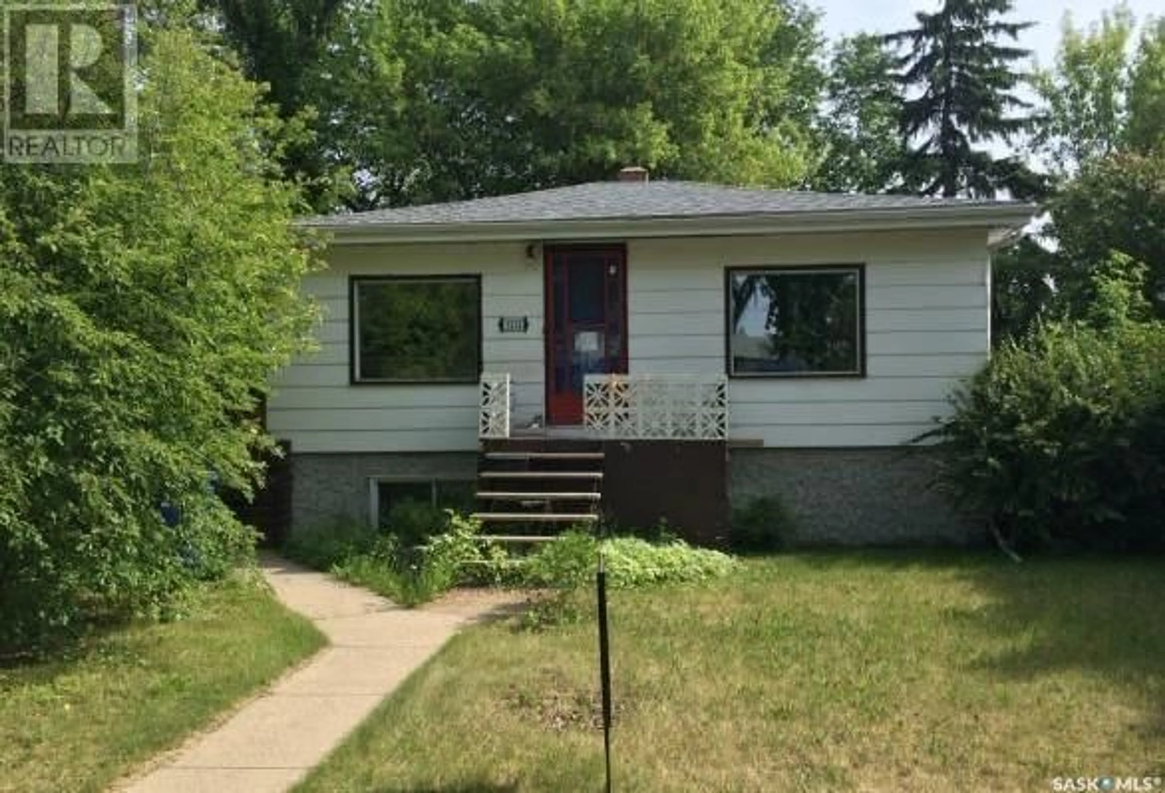 Home with vinyl exterior material, street for 1212 MAIN STREET, Saskatoon Saskatchewan S7H0L2