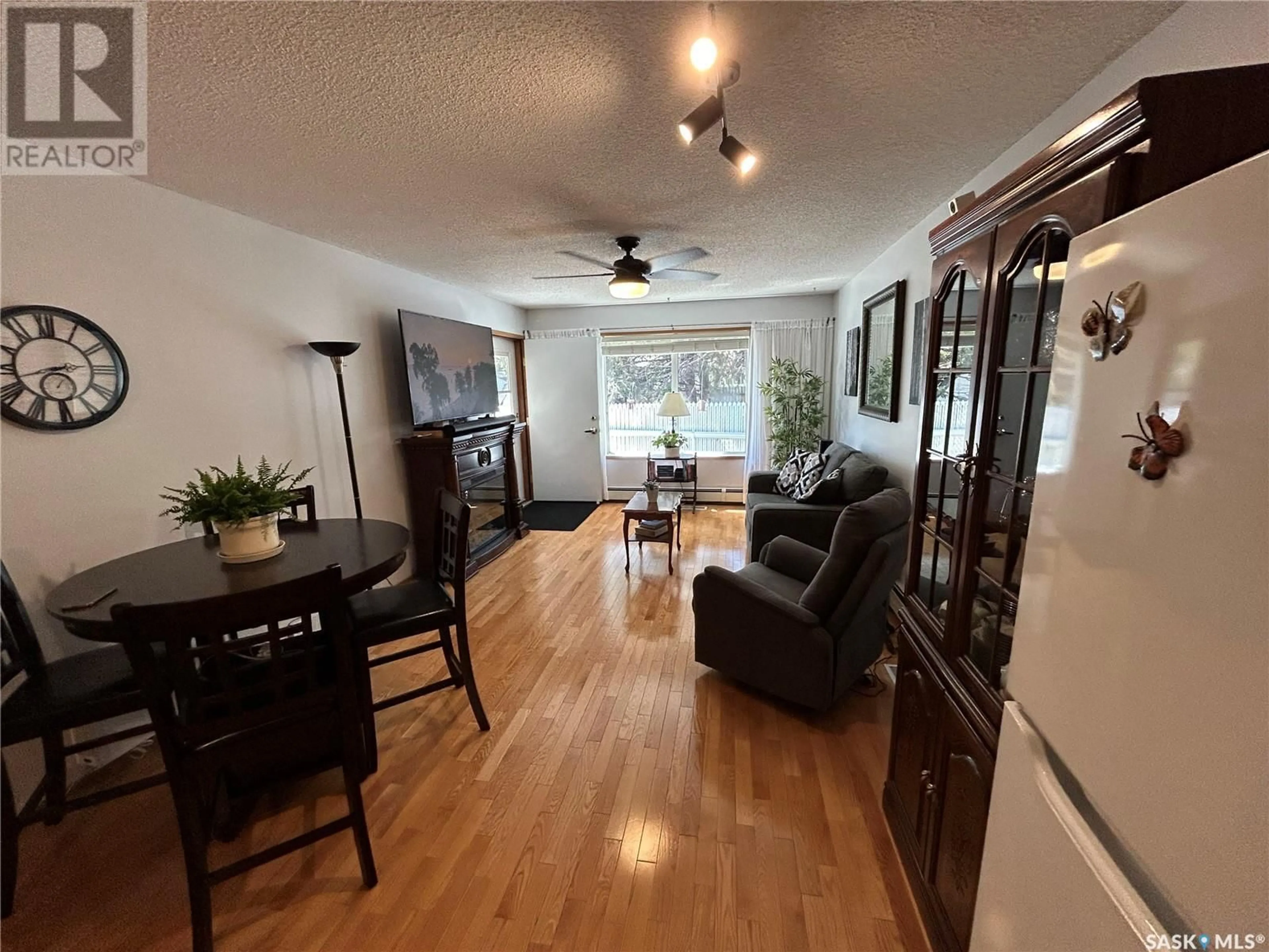 Living room with furniture, wood/laminate floor for 7 - 5004 5TH STREET, Rosthern Saskatchewan S0K3R0