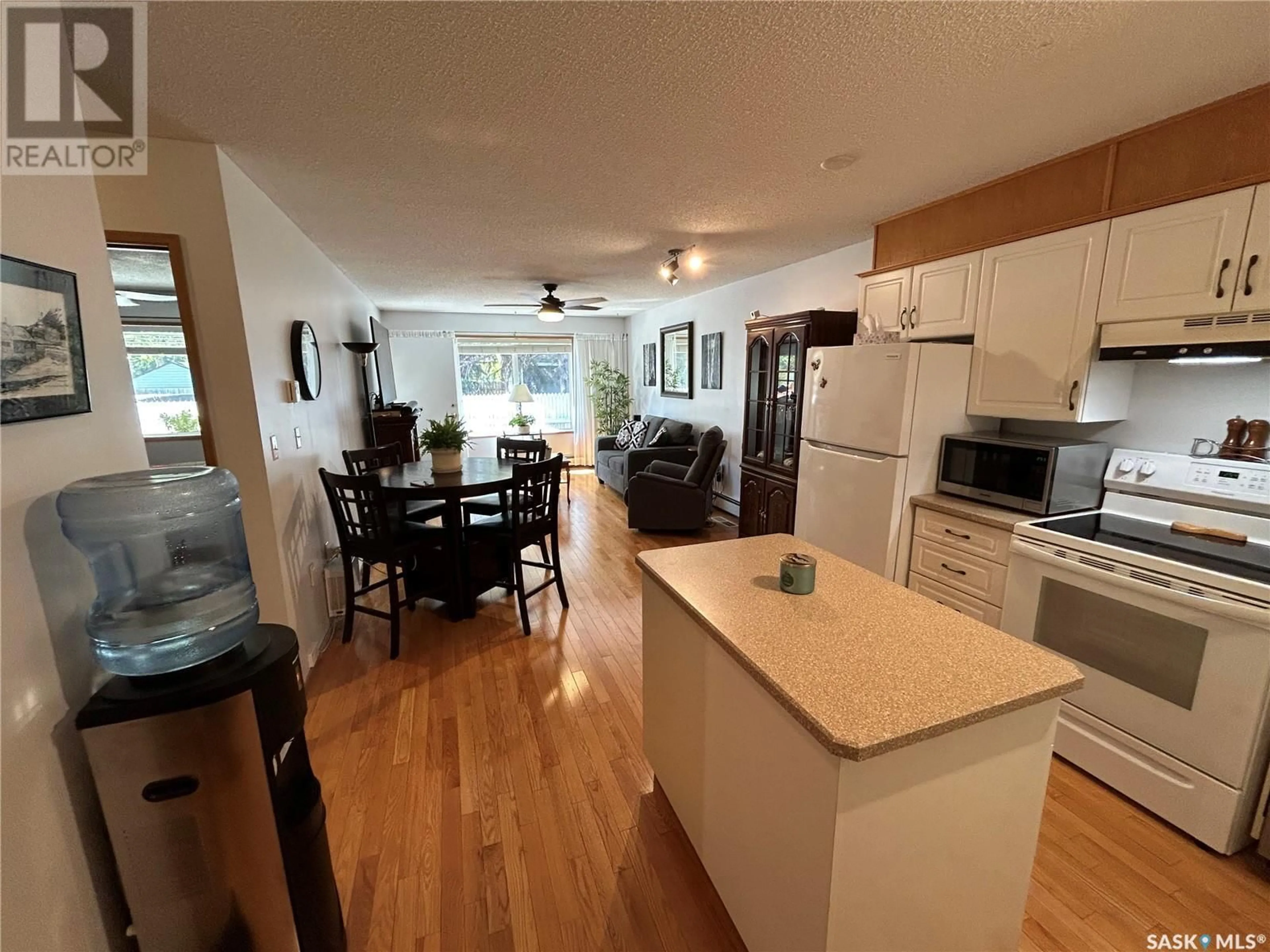 Open concept kitchen, wood/laminate floor for 7 - 5004 5TH STREET, Rosthern Saskatchewan S0K3R0