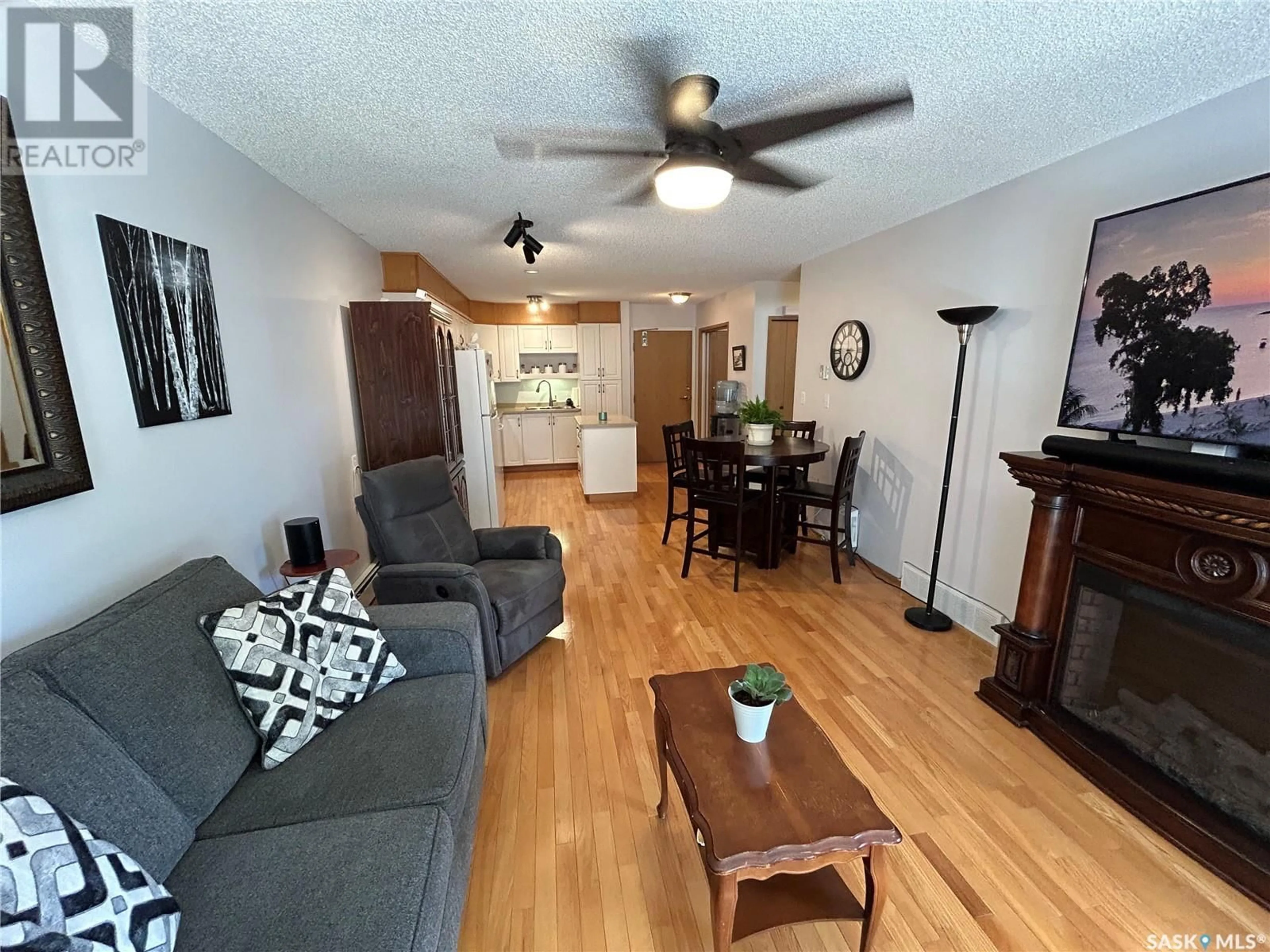 Living room with furniture, wood/laminate floor for 7 - 5004 5TH STREET, Rosthern Saskatchewan S0K3R0