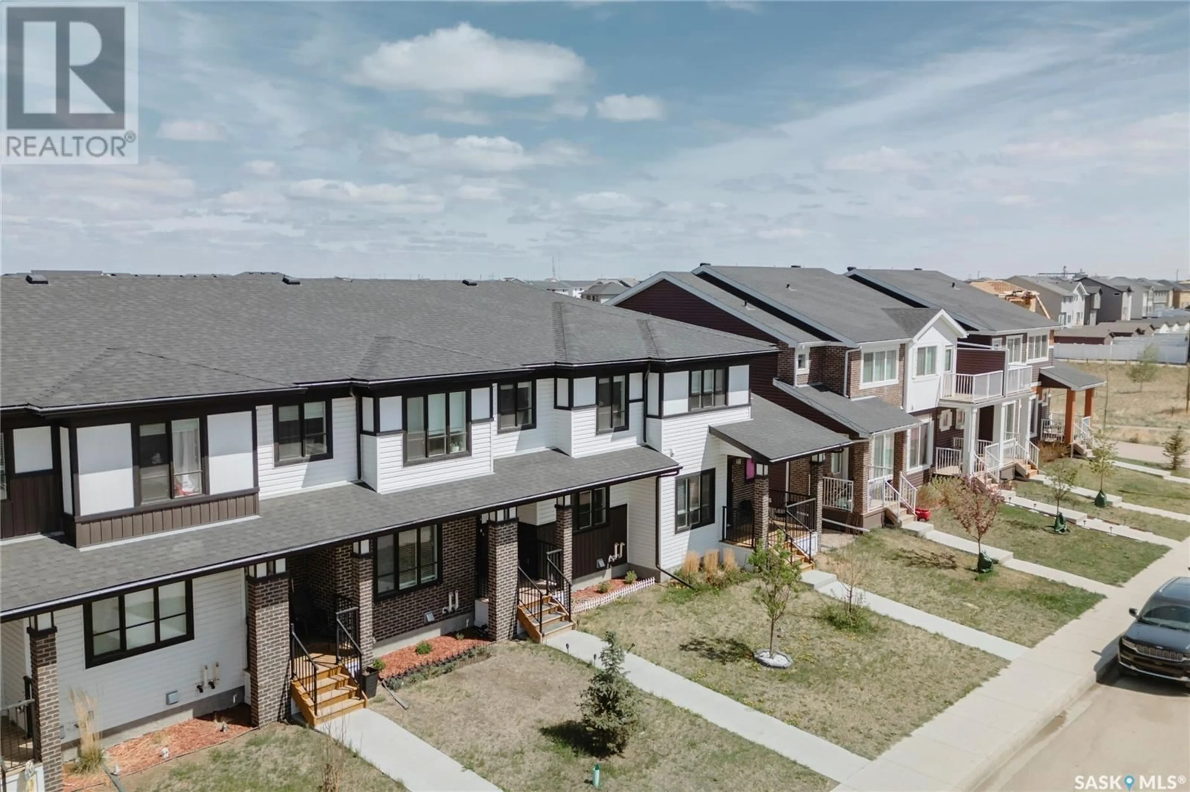 A pic from outside/outdoor area/front of a property/back of a property/a pic from drone, unknown for E - 5124 PRIMROSE GREEN DRIVE, Regina Saskatchewan S4V3S5