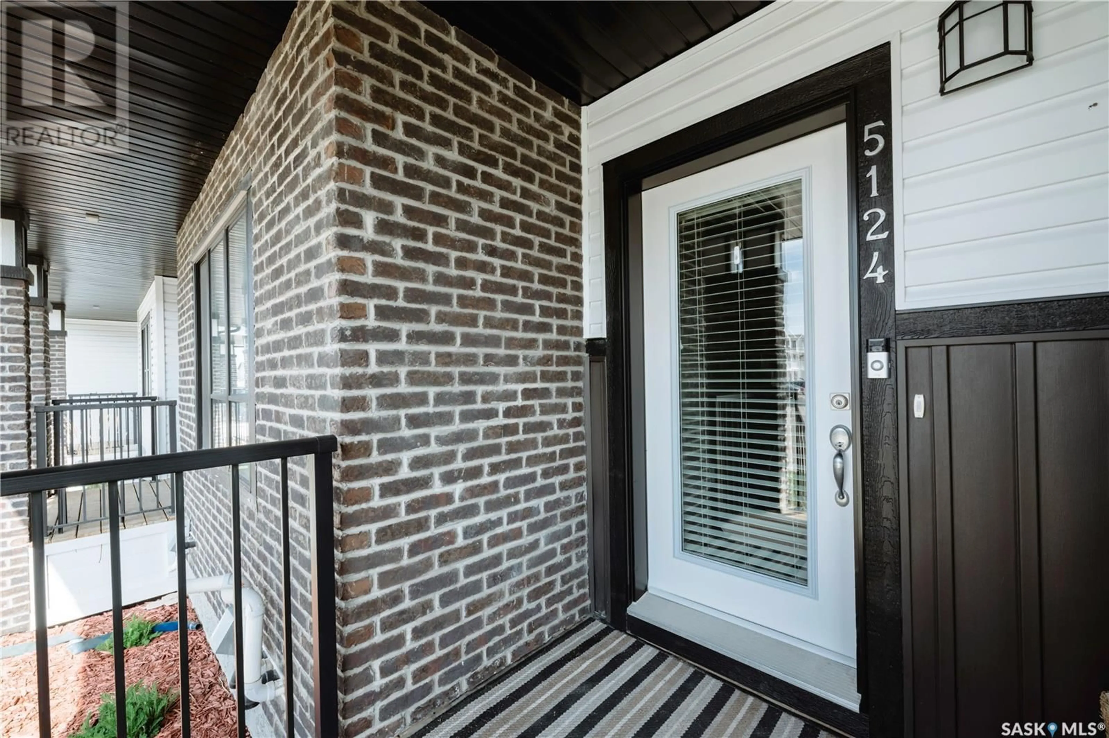 Home with brick exterior material, street for E - 5124 PRIMROSE GREEN DRIVE, Regina Saskatchewan S4V3S5